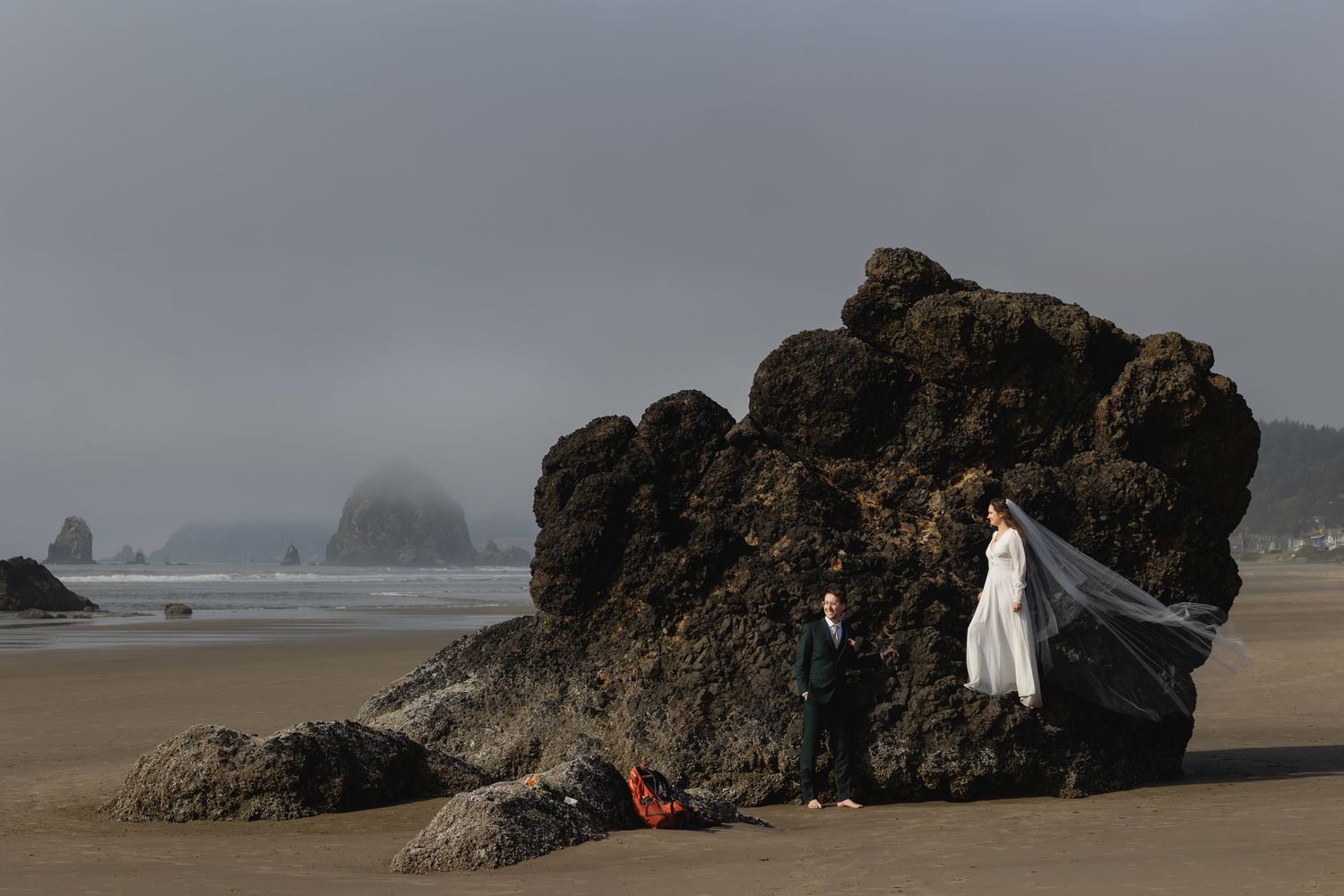 A series of moody beach landscape photos showing rocks and misty coastline at Cannon Beach, Oregon during overcast weather.