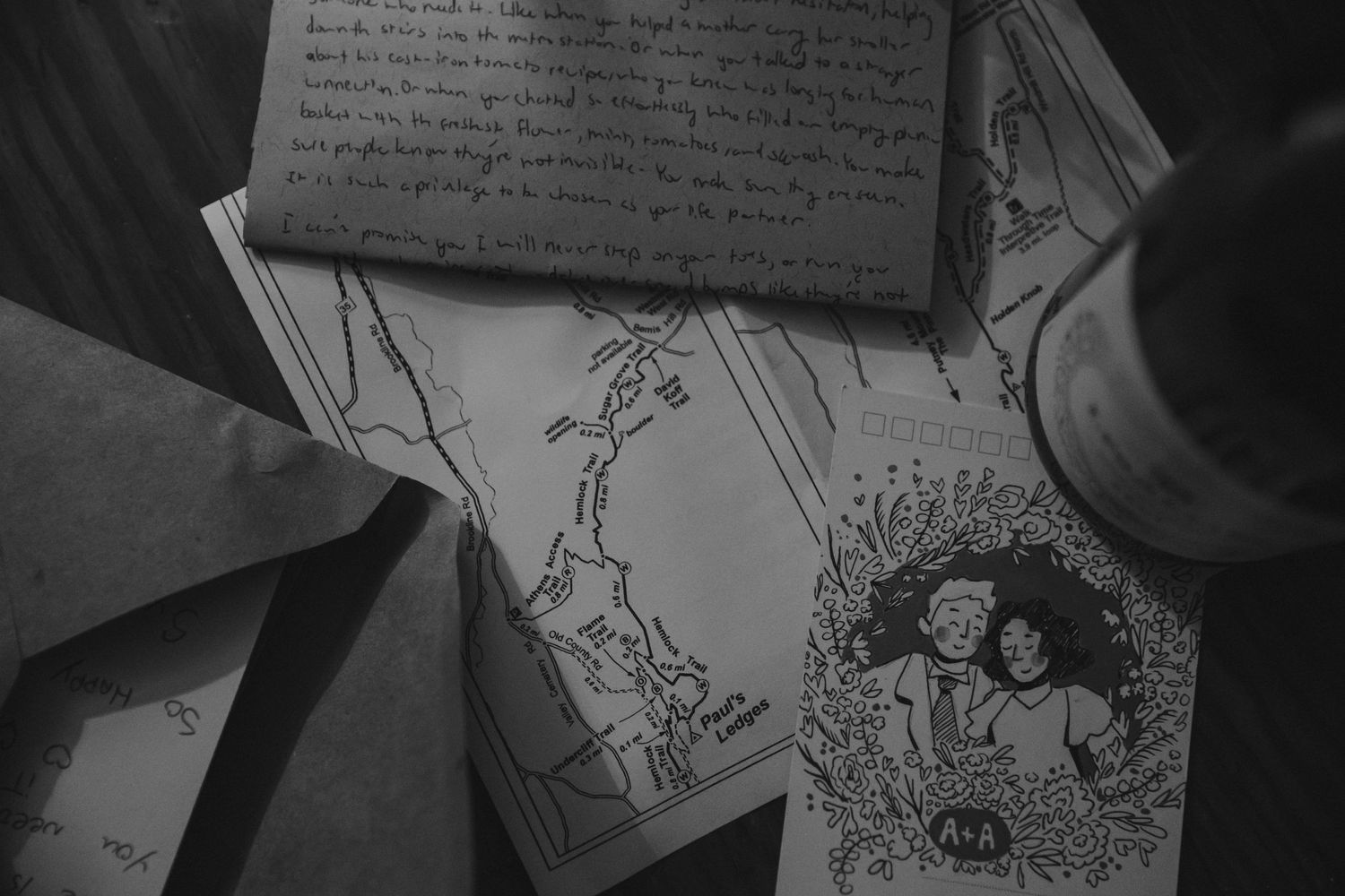 A vintage black and white photograph of handwritten notes and sketches.