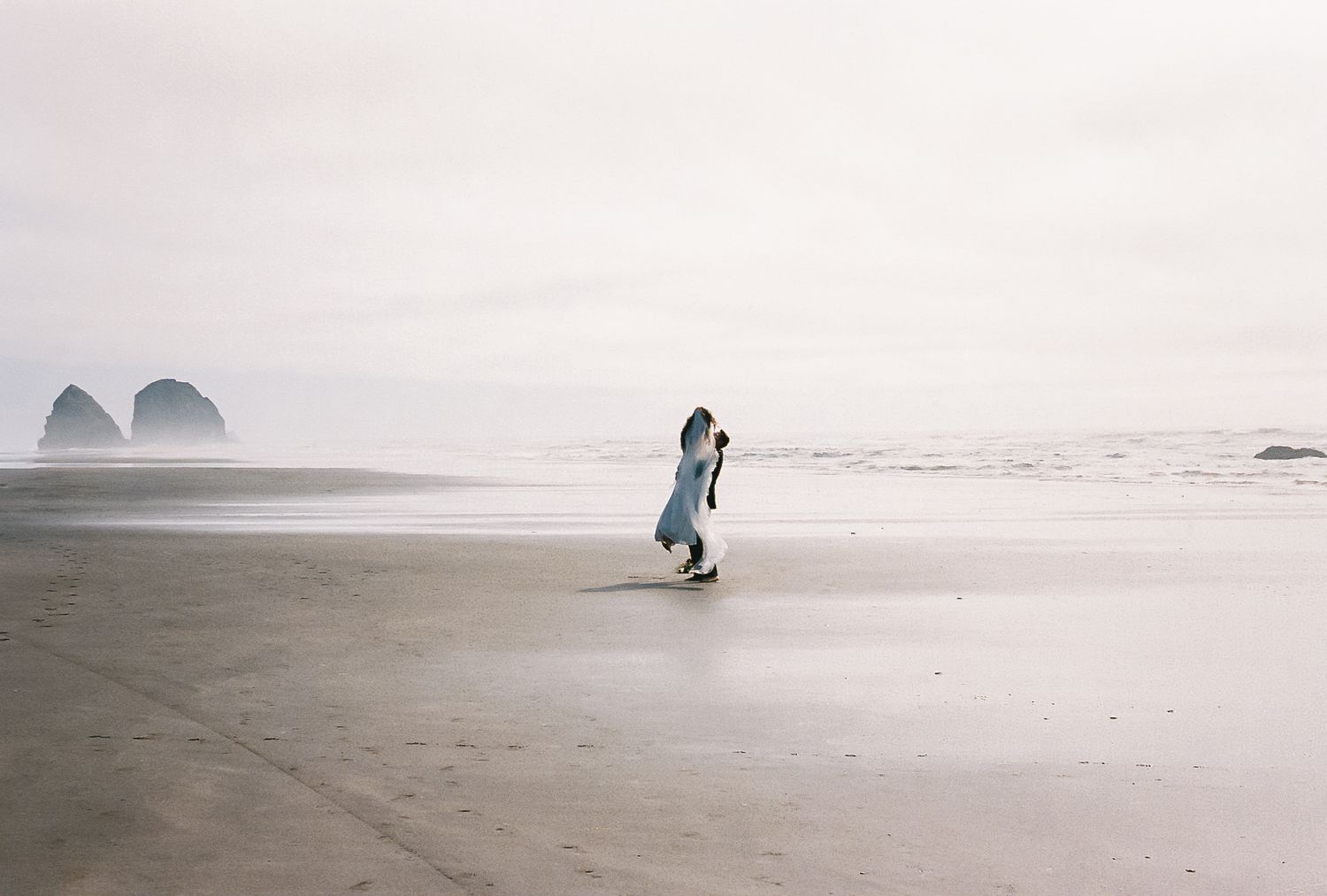 A series of foggy beach scenes with silhouettes walking along the misty shoreline at dusk.