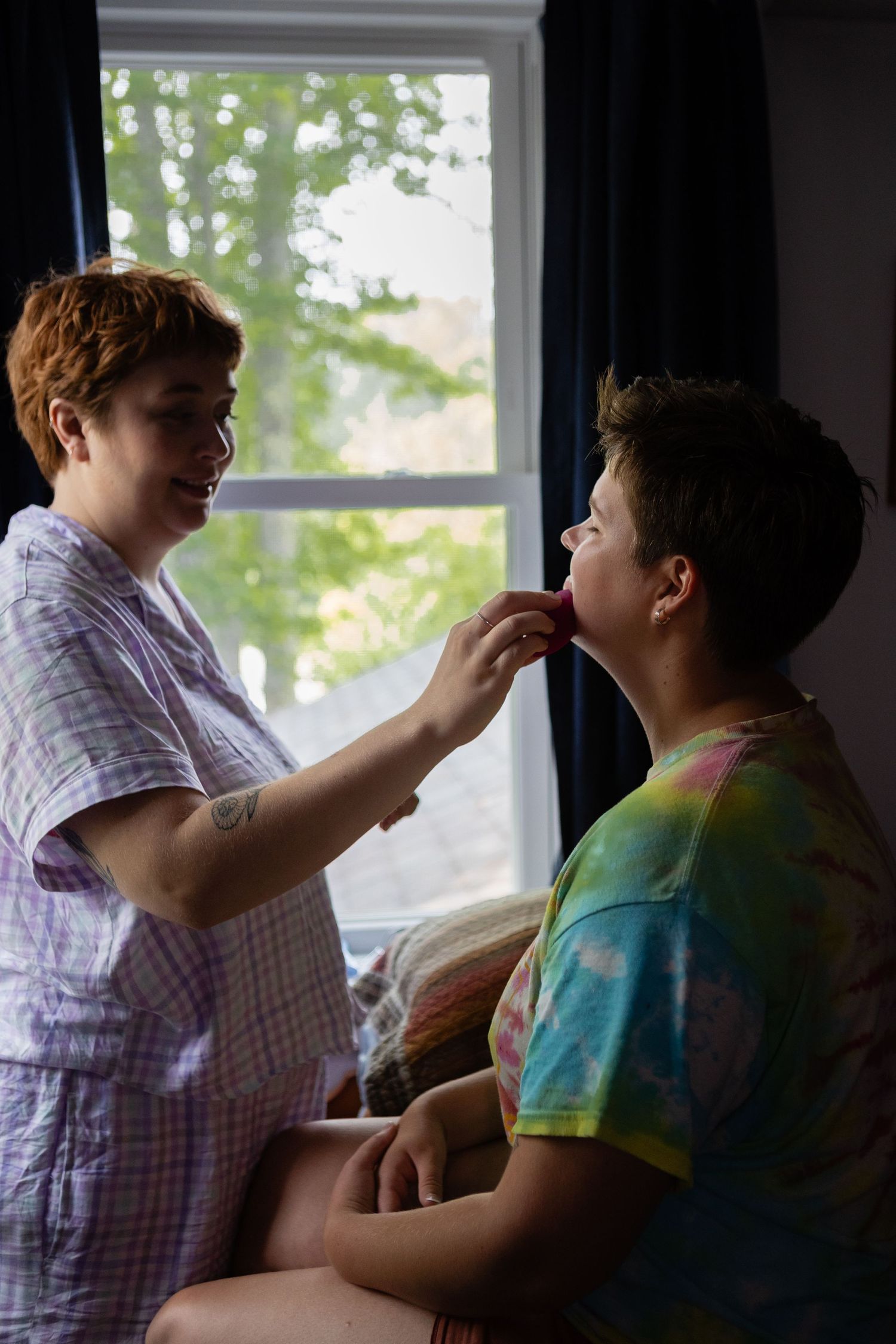 Getting ready scene in front of window with soft natural lighting.