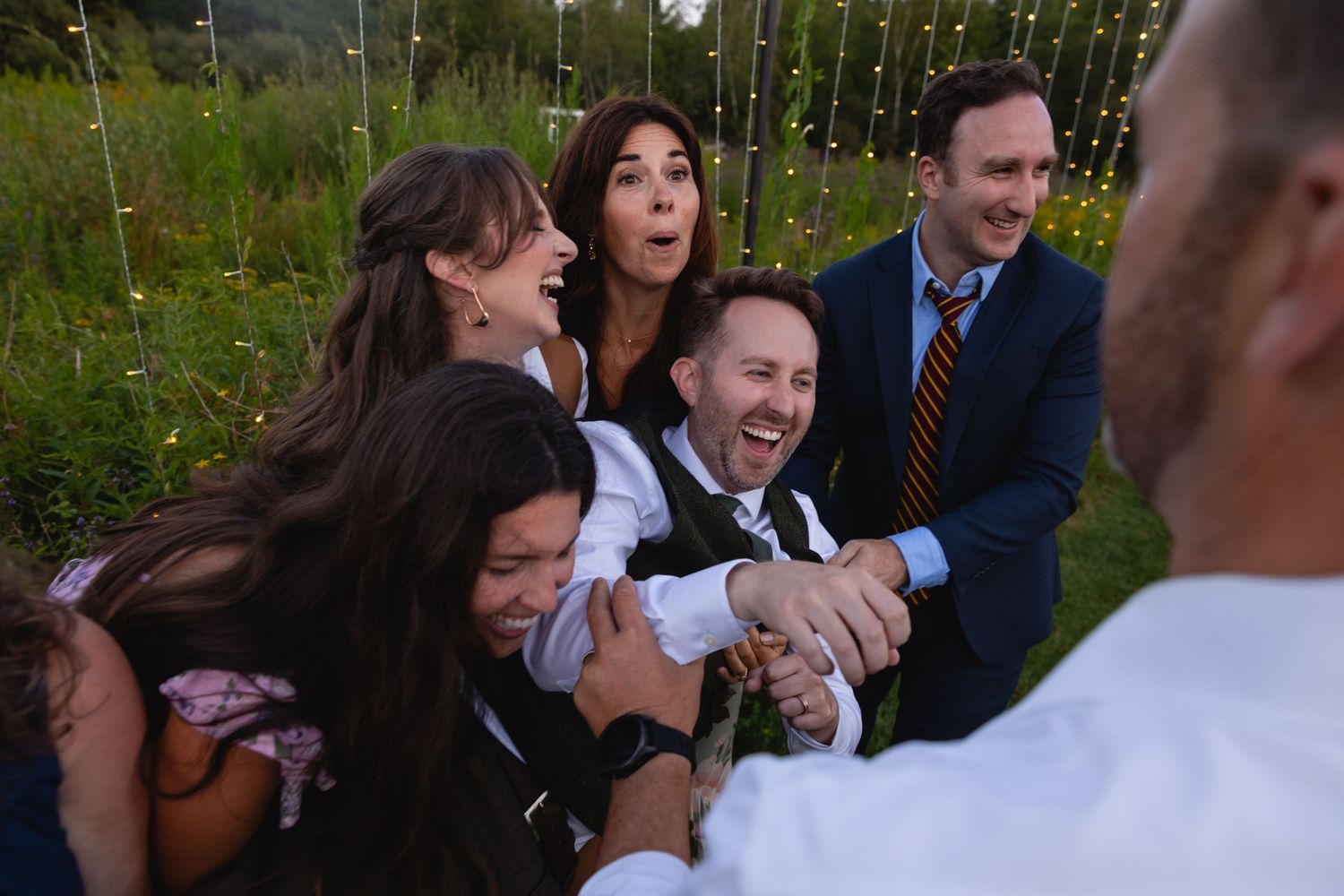 A sequence of candid reactions and joyful moments captured during an outdoor wedding celebration.