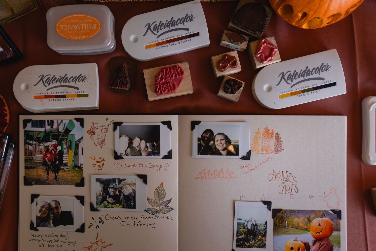 A wall decorated with polaroid photos and personal mementos creates a cozy collage display in warm lighting.