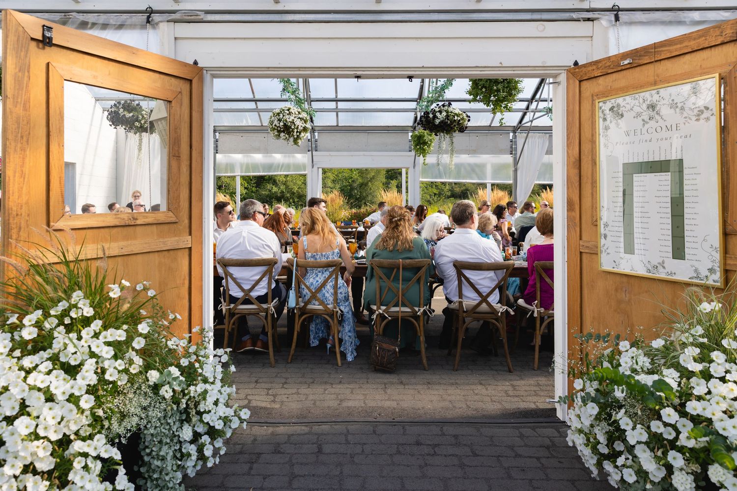 A collage of elegant wedding venue photos showing decorated tables, floral arrangements, and rustic interior spaces.