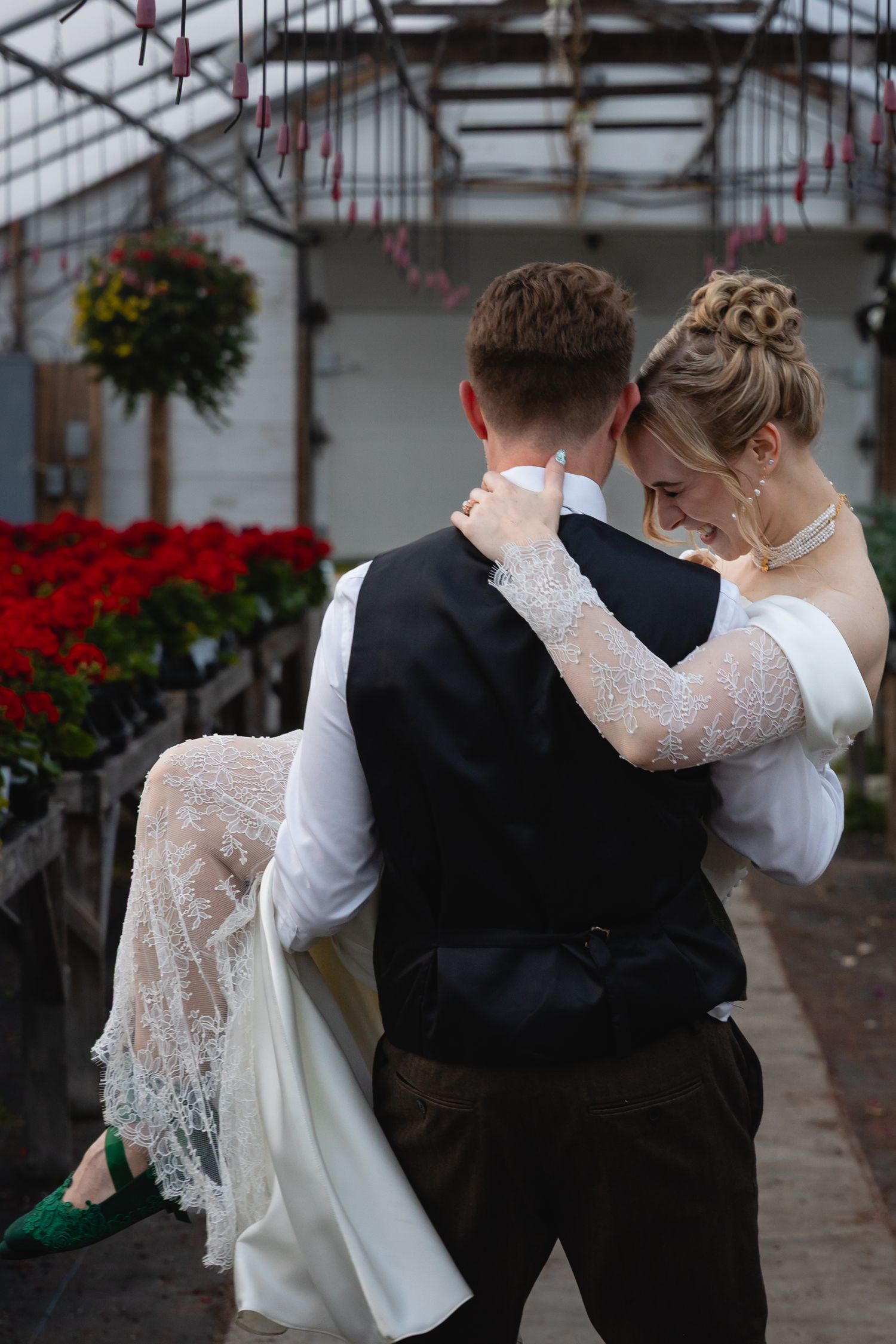 A romantic dance sequence between a couple in wedding attire, with the bride wearing a lace-sleeved white gown.
