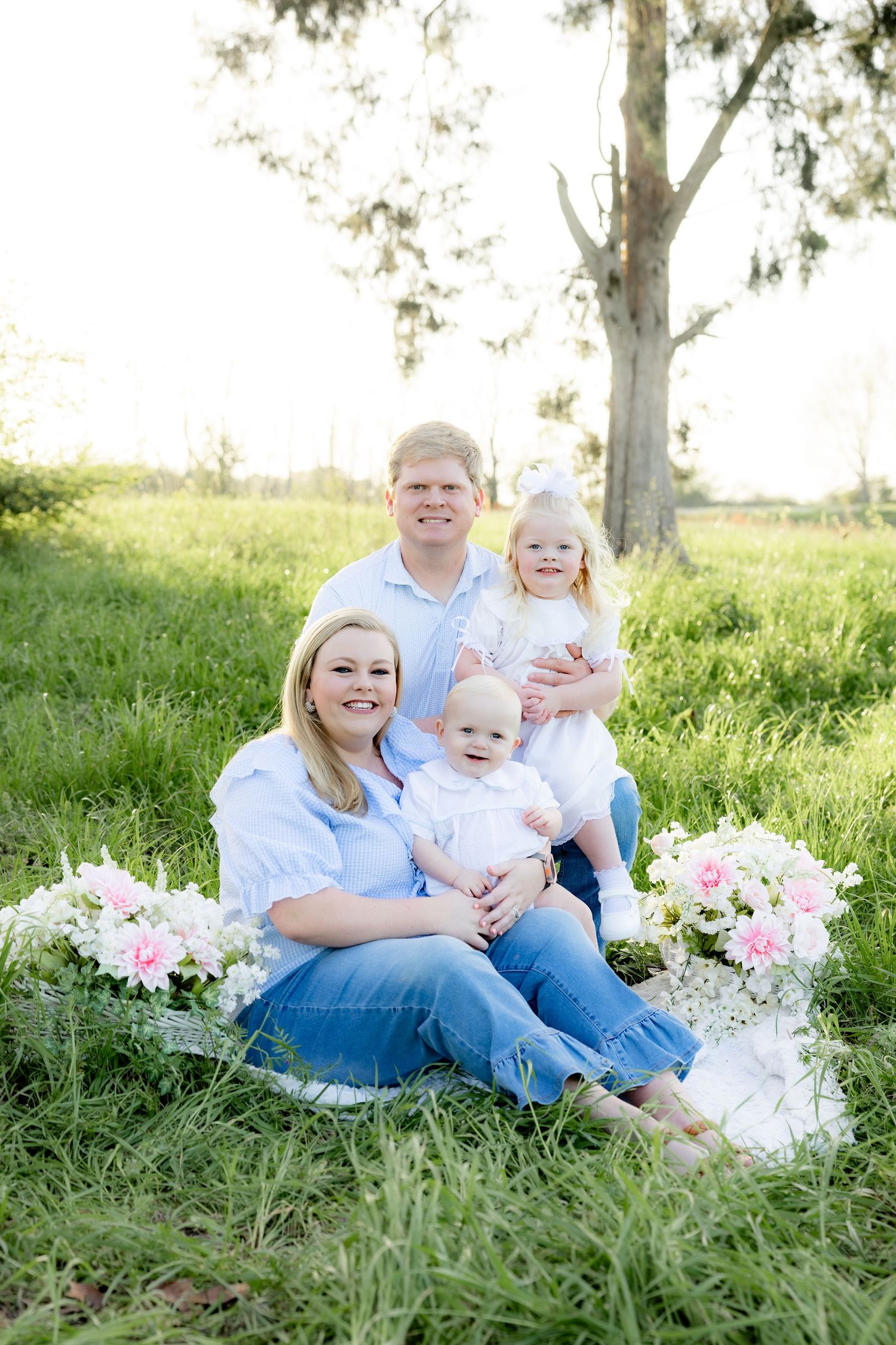 Spring Mini Session with baby chicks in a grass field at sunset near Dothan, Alabama