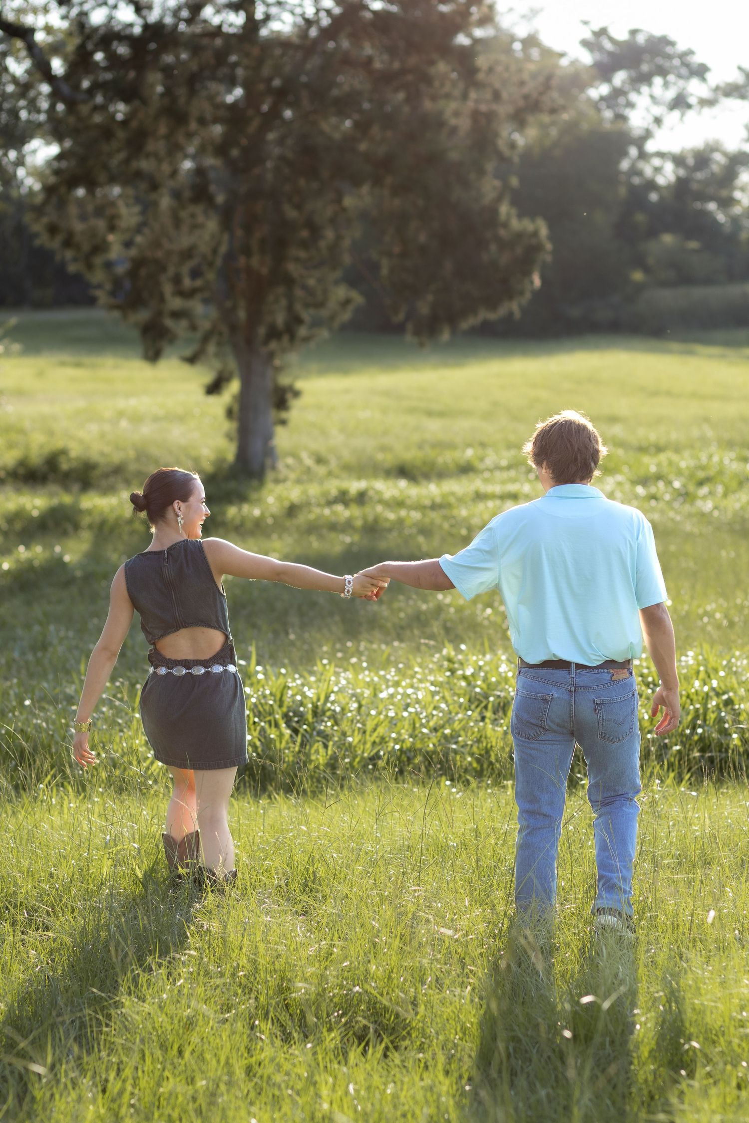 Romantic Couples photos in a tall grass field at sunset near Dothan, Alabama