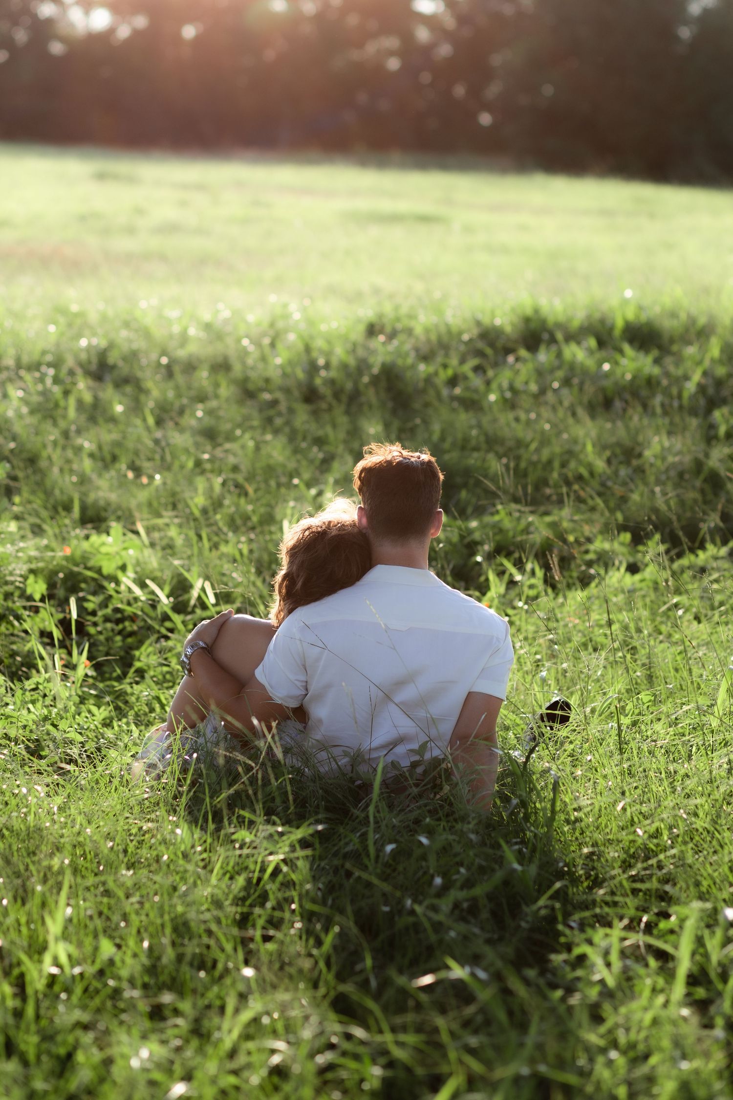 Romantic Couples photos in a tall grass field at sunset near Dothan, Alabama