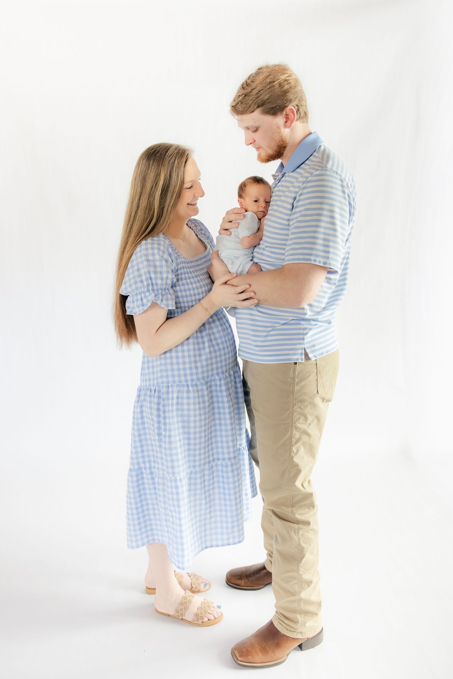 Family holding their baby in a studio in Dothan, Alabama