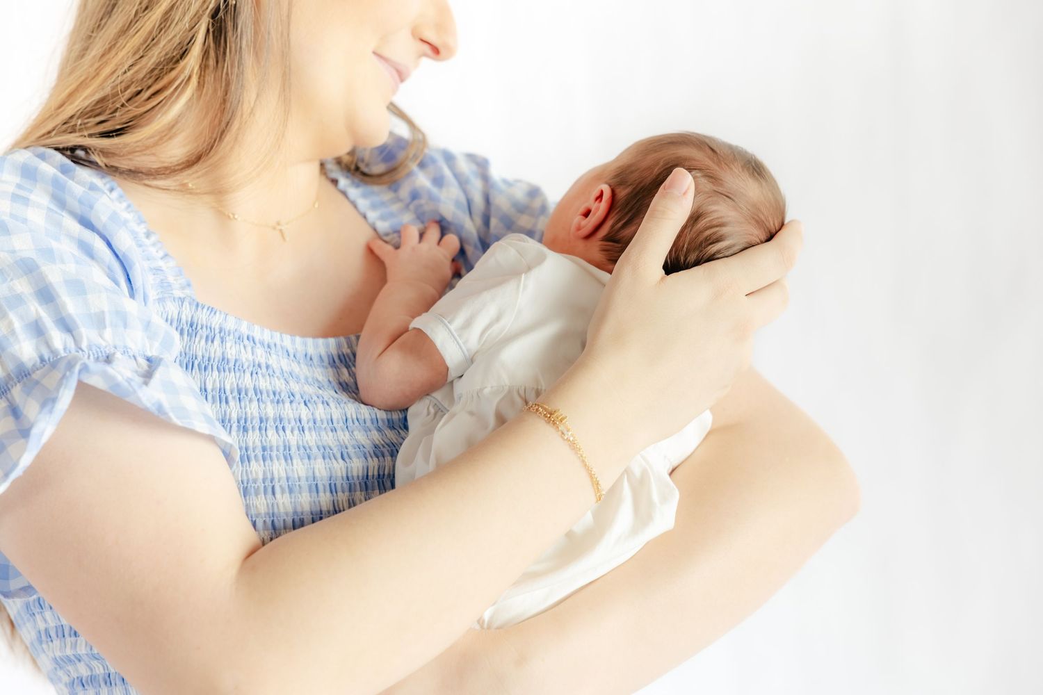 Mother holding her baby in a studio in Dothan, Alabama