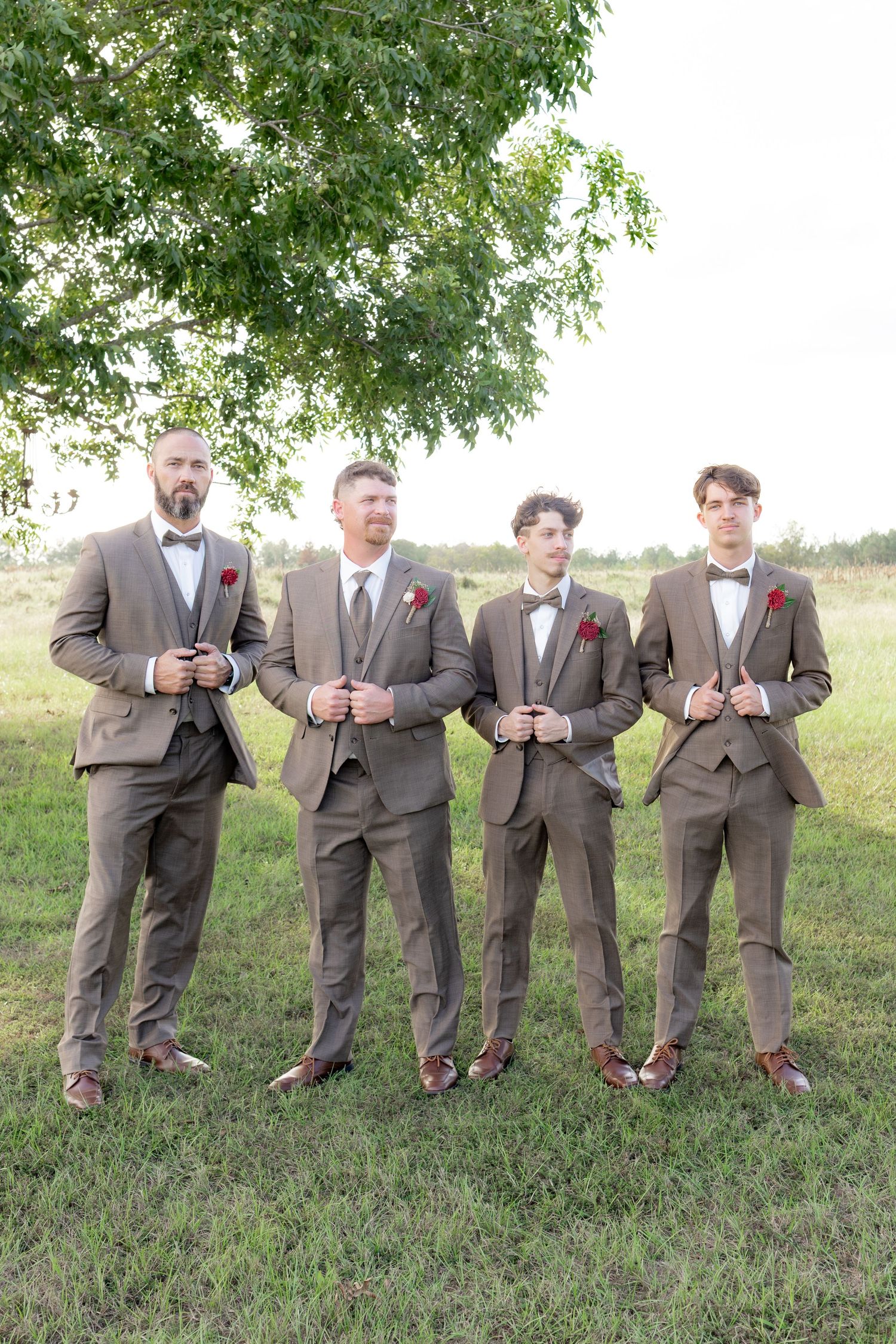 Bridal party posing in a field at sunset at Hilltop Acres Wicksburg, Alabama