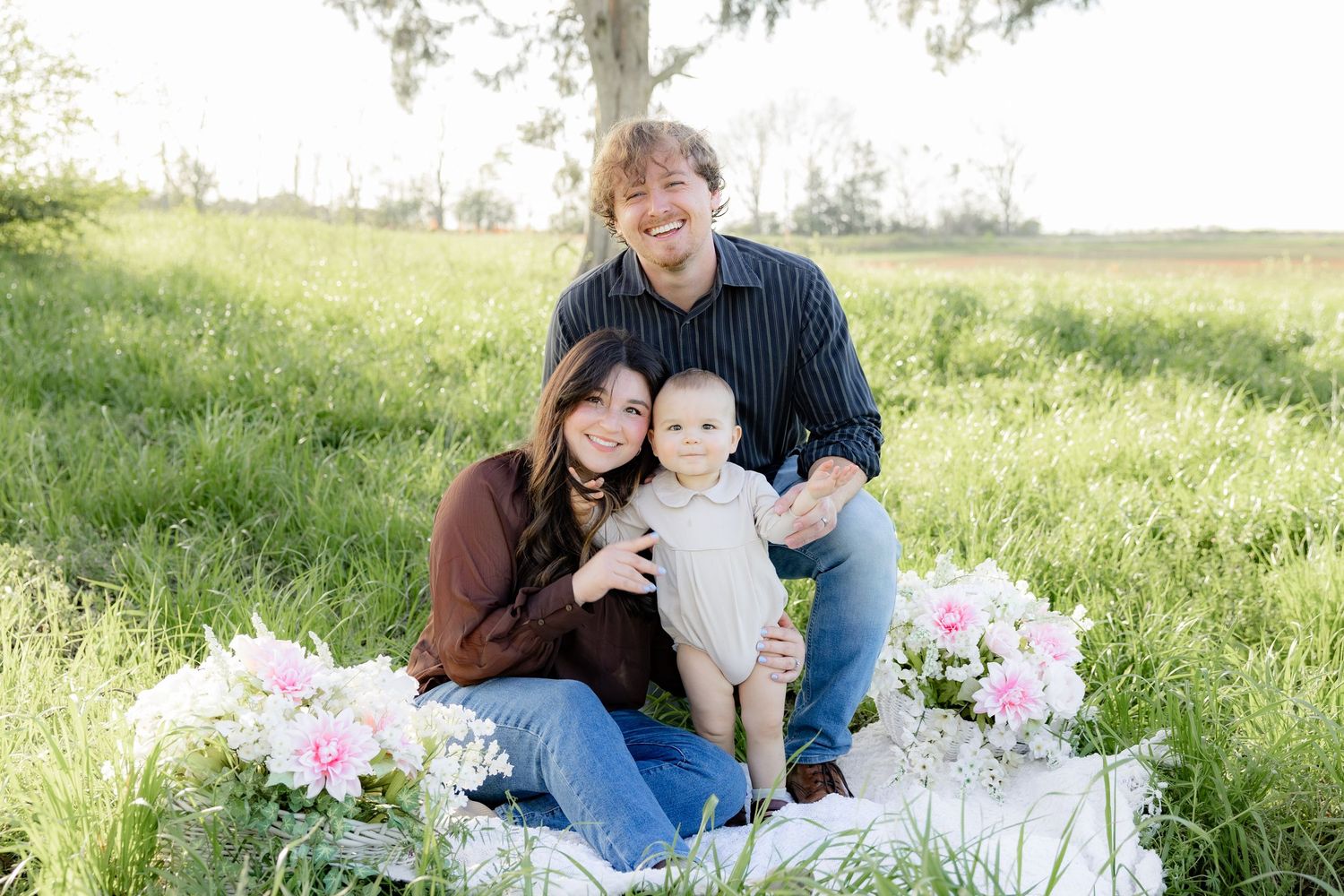 Spring Mini Session with baby chicks in a grass field at sunset near Dothan, Alabama