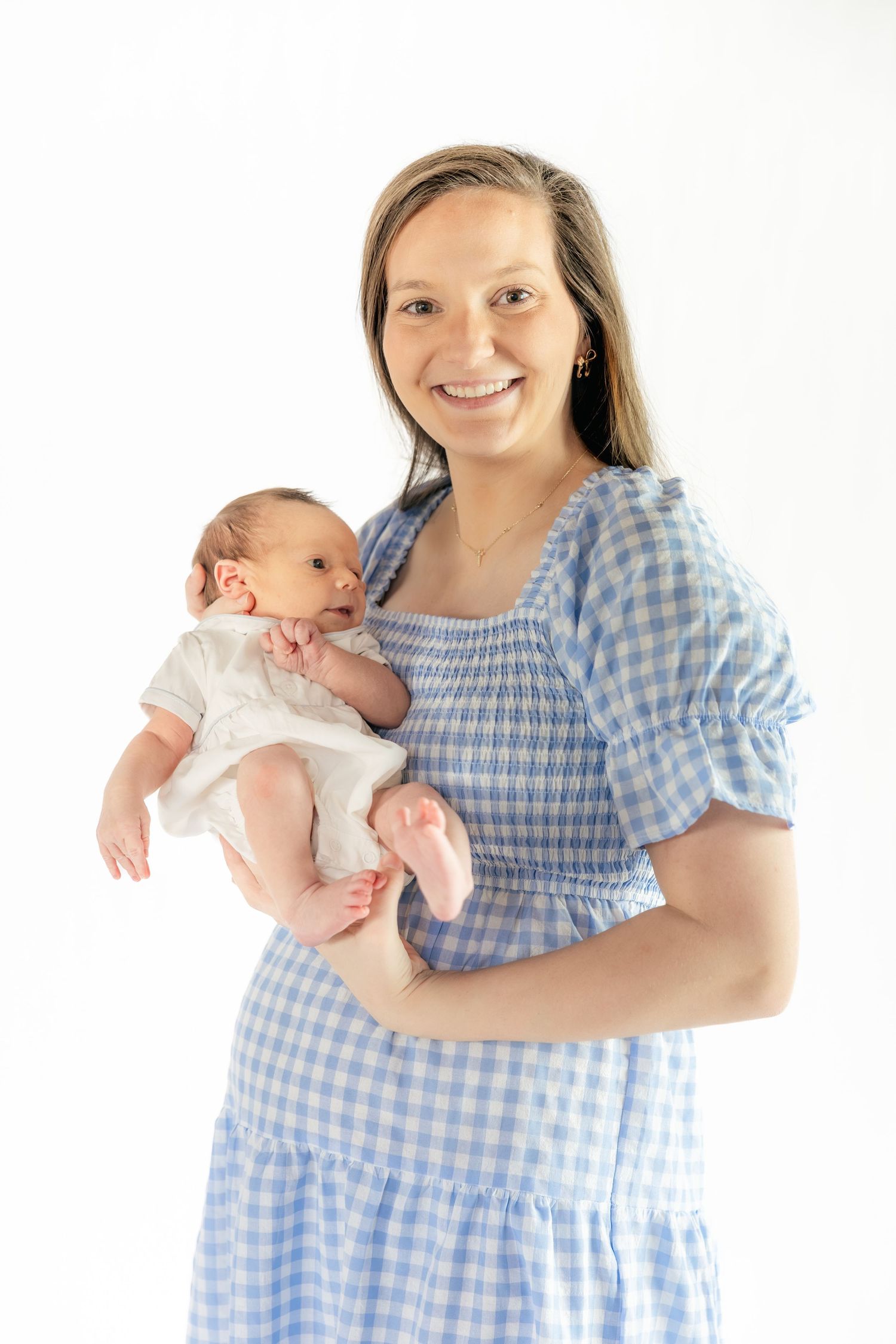 Mother holding her baby in a Studio in Dothan, Alabama