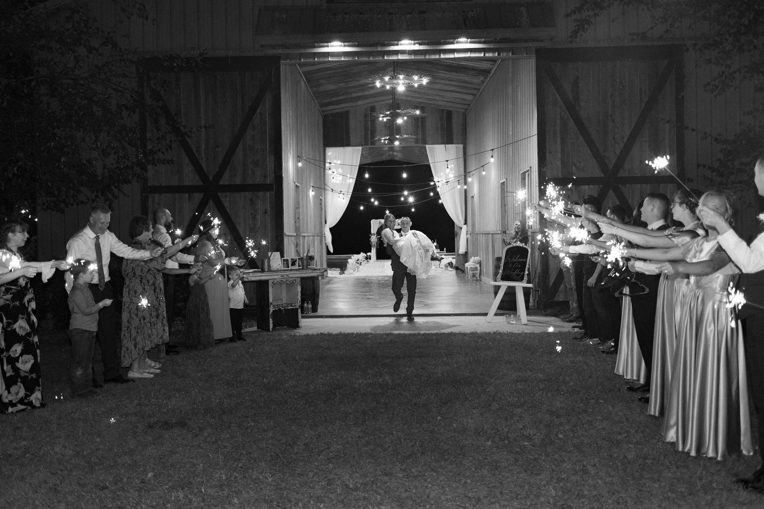 Bride and groom running through a sparkler exit at Dalrymple Farms Enterprise, Alabama