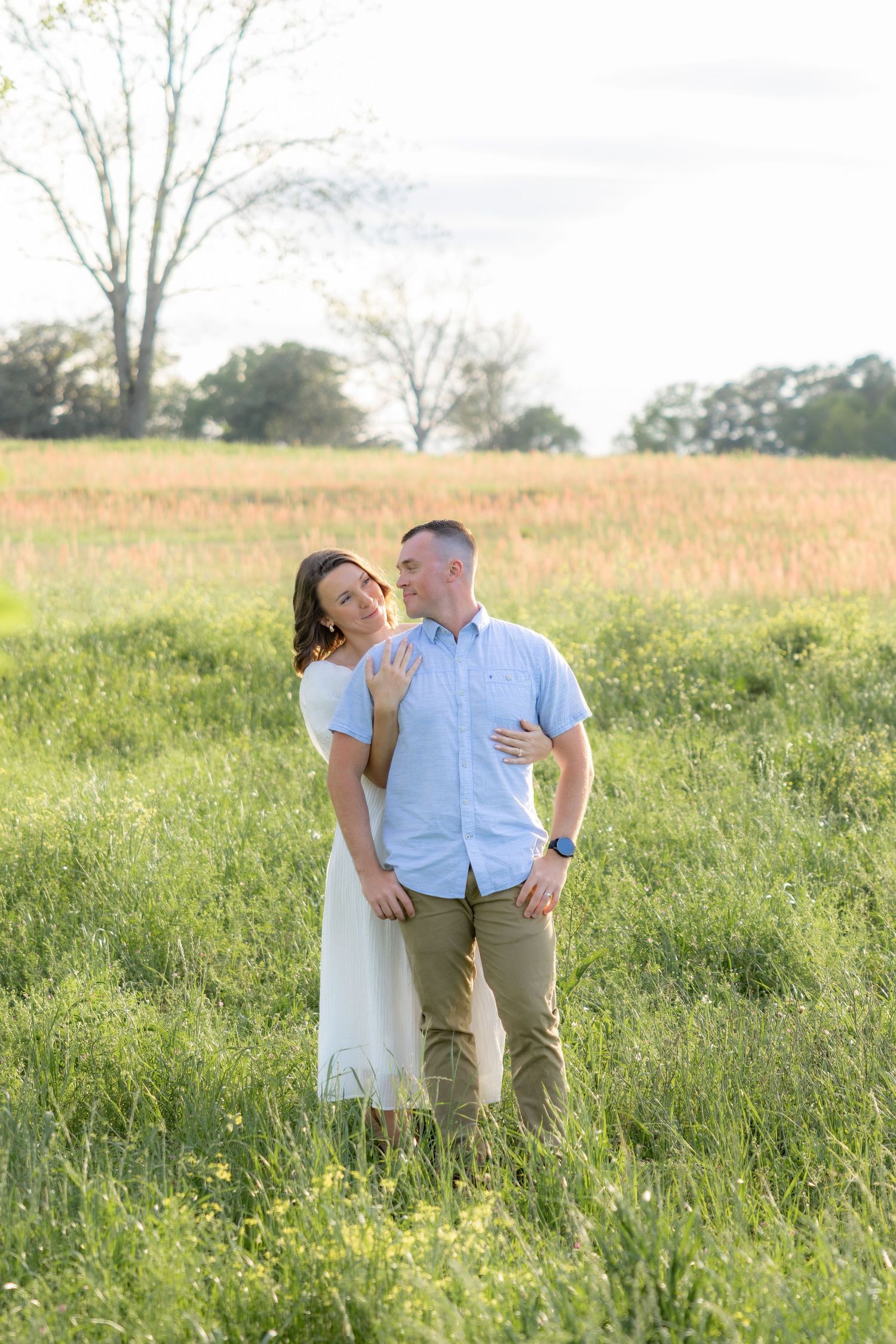 Storytelling romantic couple photos in a tall grass field at sunset in Dothan, Alabama