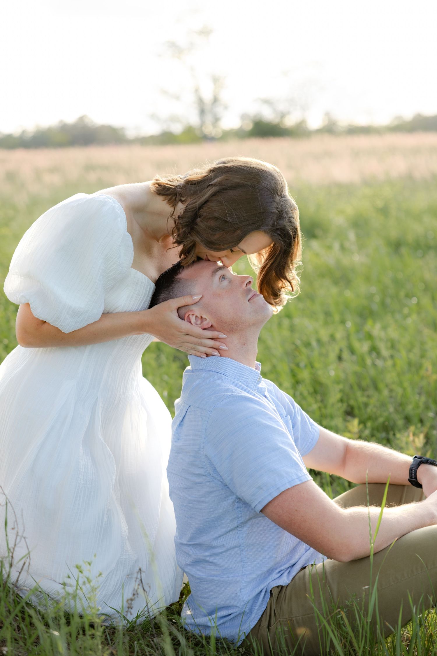 Storytelling romantic couple photos in a tall grass field at sunset in Dothan, Alabama