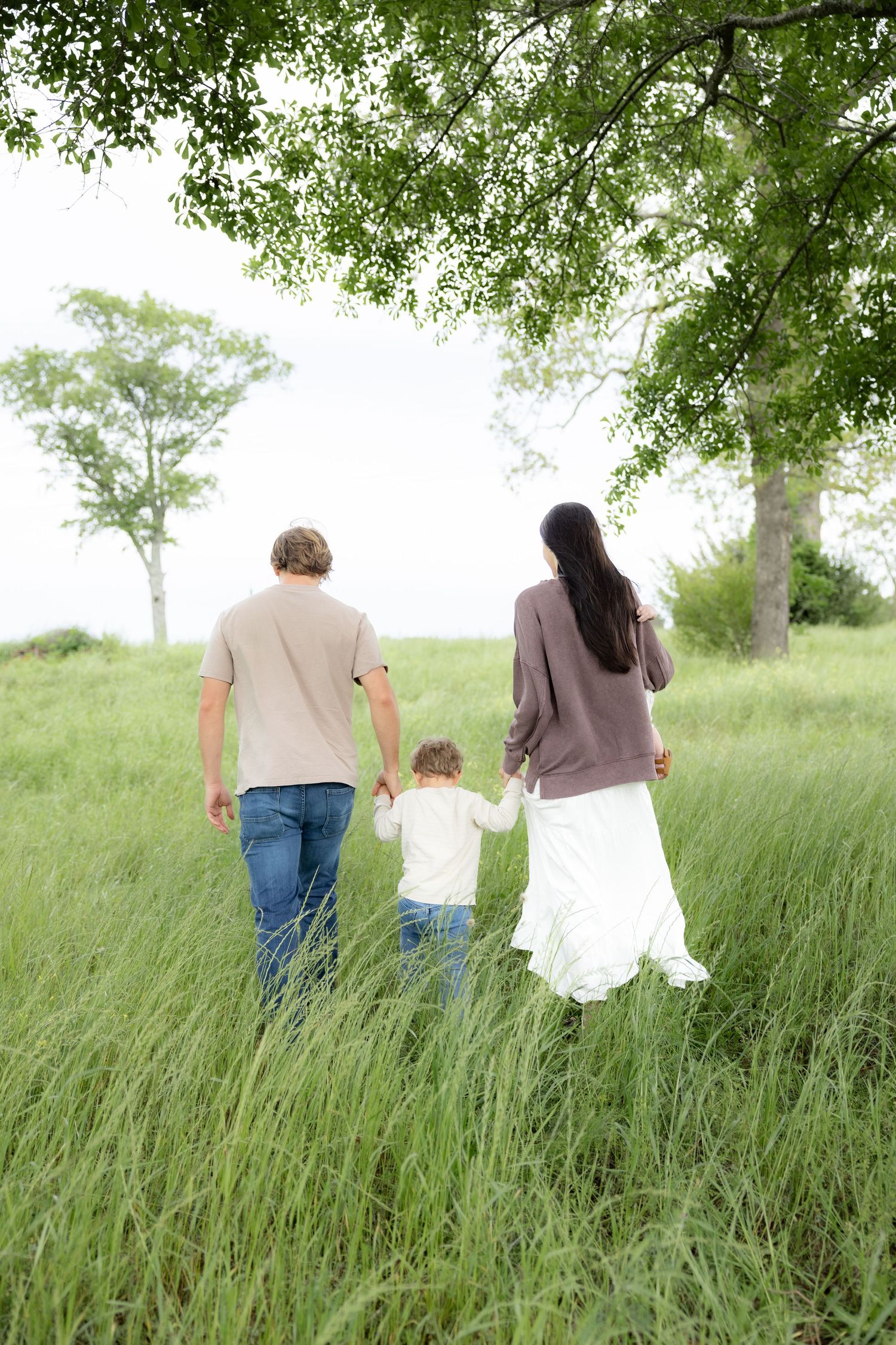 Candid family photos in a grass field | Dothan, Alabama Lifestyle Portrait Photographer