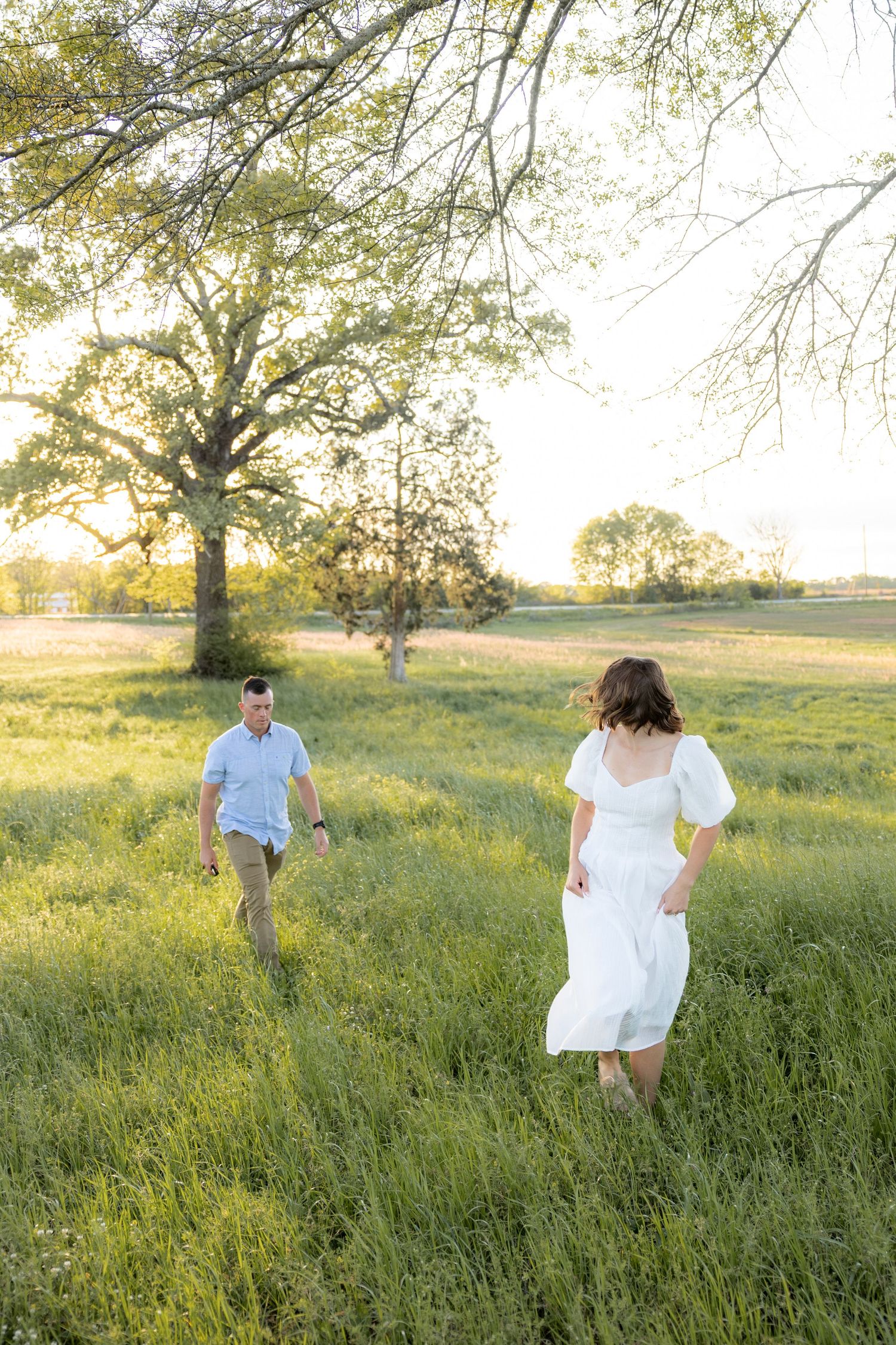 Storytelling couple photos in a tall grass field at sunset in Dothan, Alabama