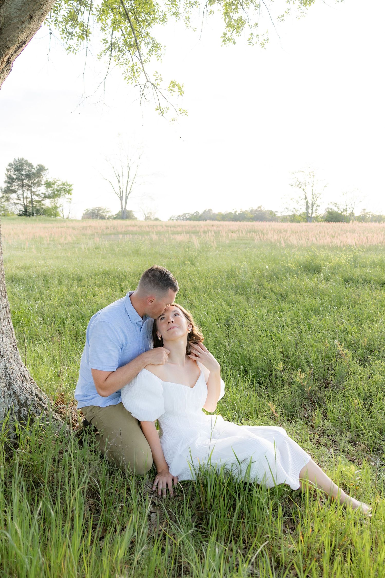 Storytelling couple photos in a tall grass field at sunset in Dothan, Alabama
