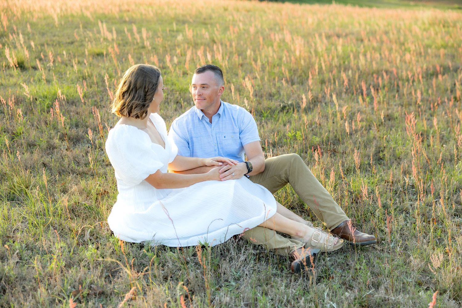 Storytelling couple photos in a tall grass field at sunset in Dothan, Alabama