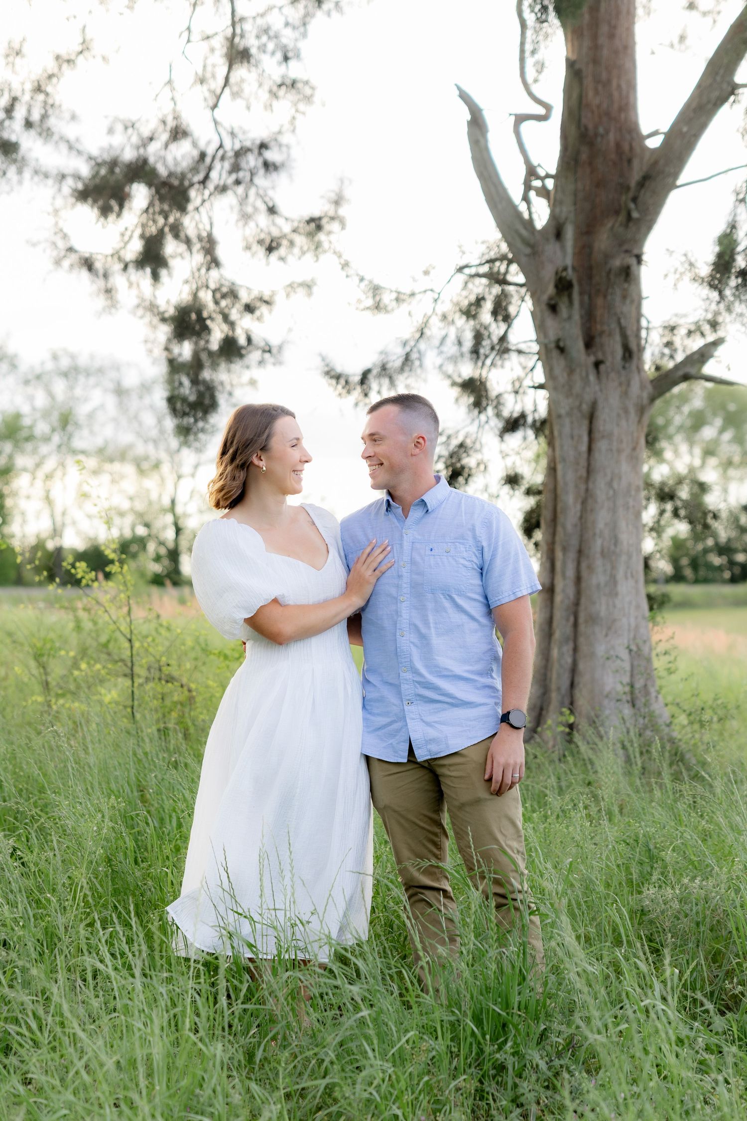 Storytelling romantic couple photos in a tall grass field at sunset in Dothan, Alabama
