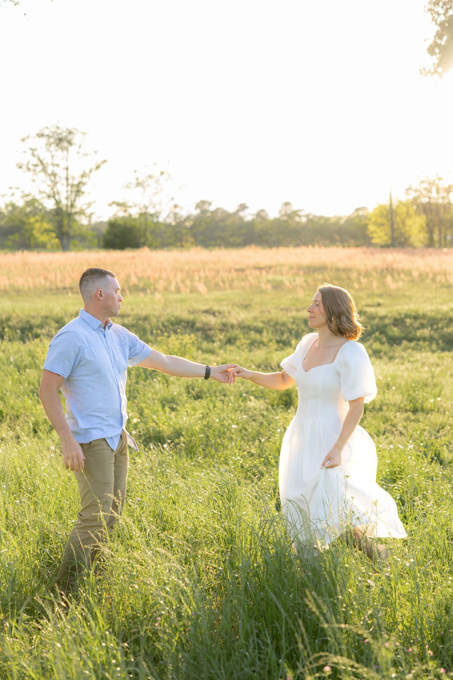 Storytelling couple photos in a tall grass field at sunset in Dothan, Alabama