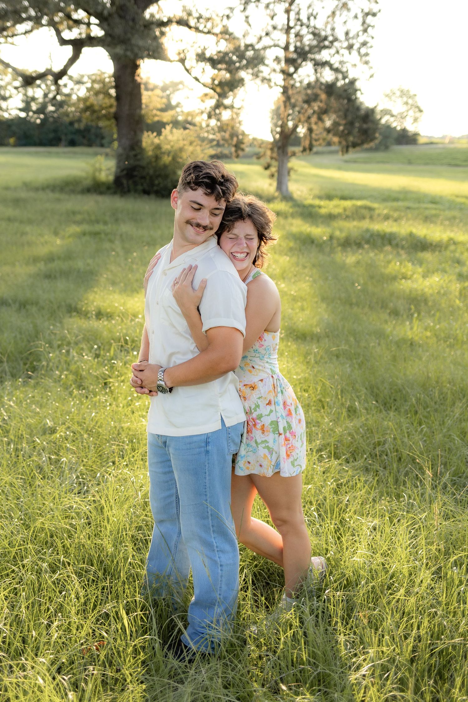 Romantic Couples photos in a tall grass field at sunset near Dothan, Alabama