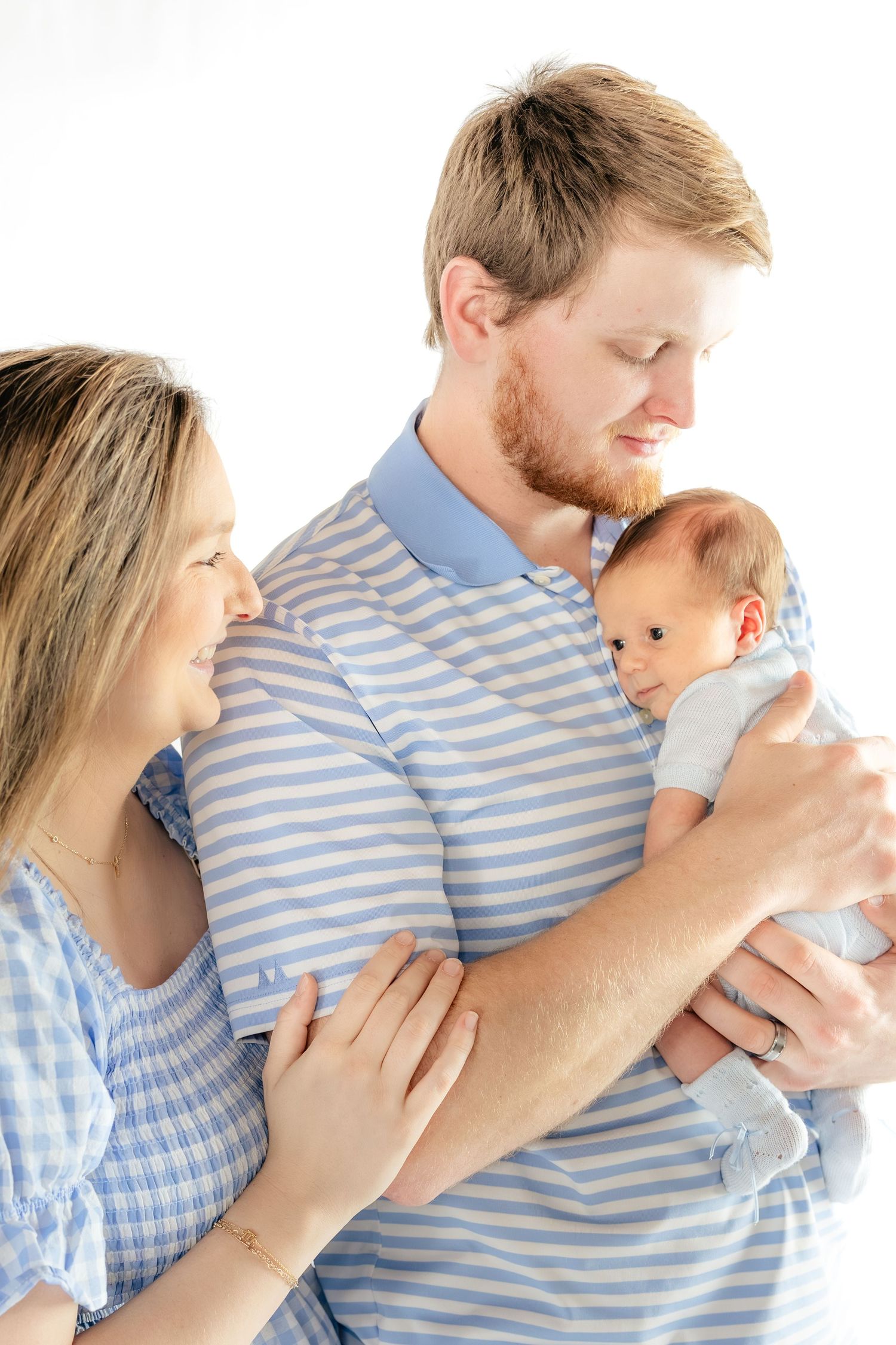 Family holding their baby in a studio in Dothan, Alabama