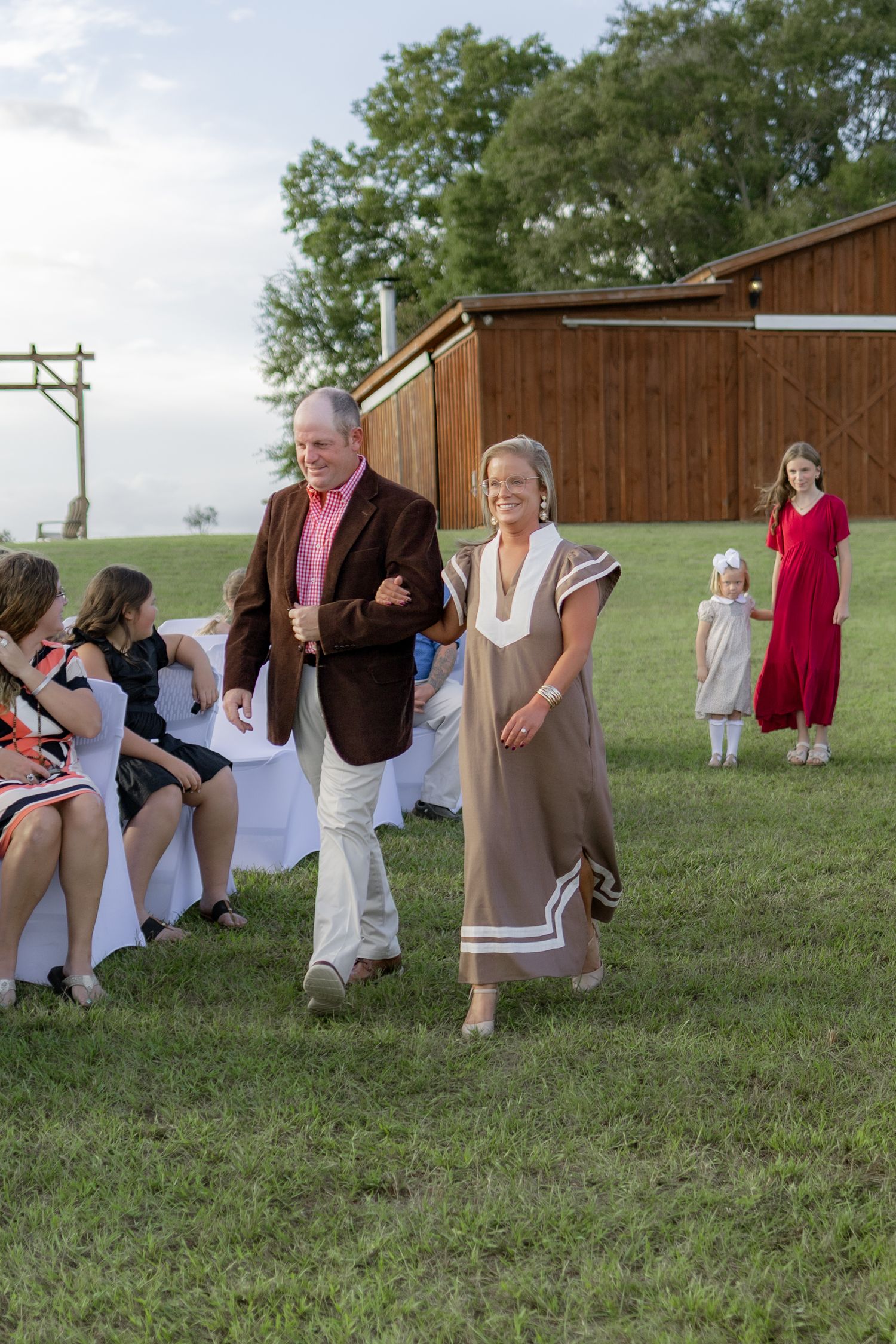 Bridal party walking down the aisle of a wedding at Hilltop Acres Wicksburg, Alabama
