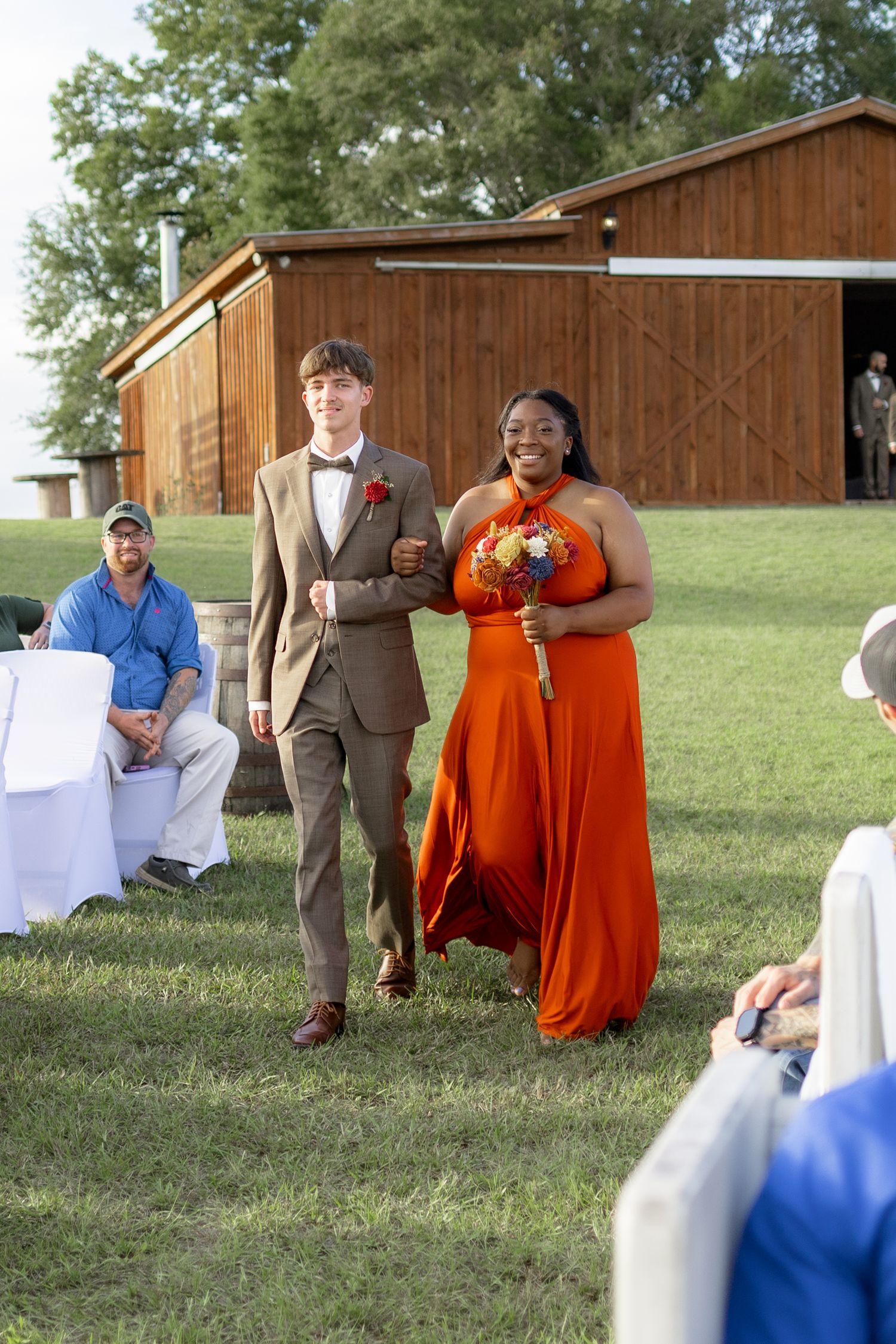 Bridal party walking down the aisle of a wedding at Hilltop Acres Wicksburg, Alabama