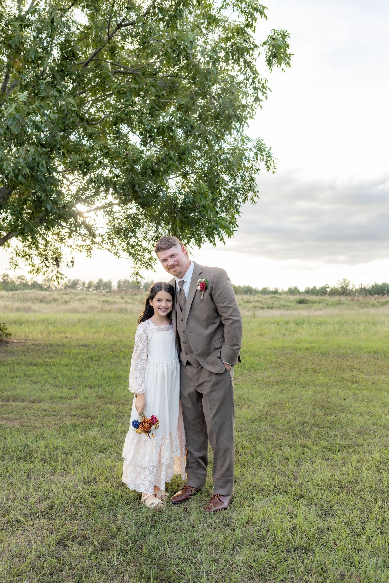 Groom with his daughter on his wedding day at Hilltop Acres Wicksburg, Alabama