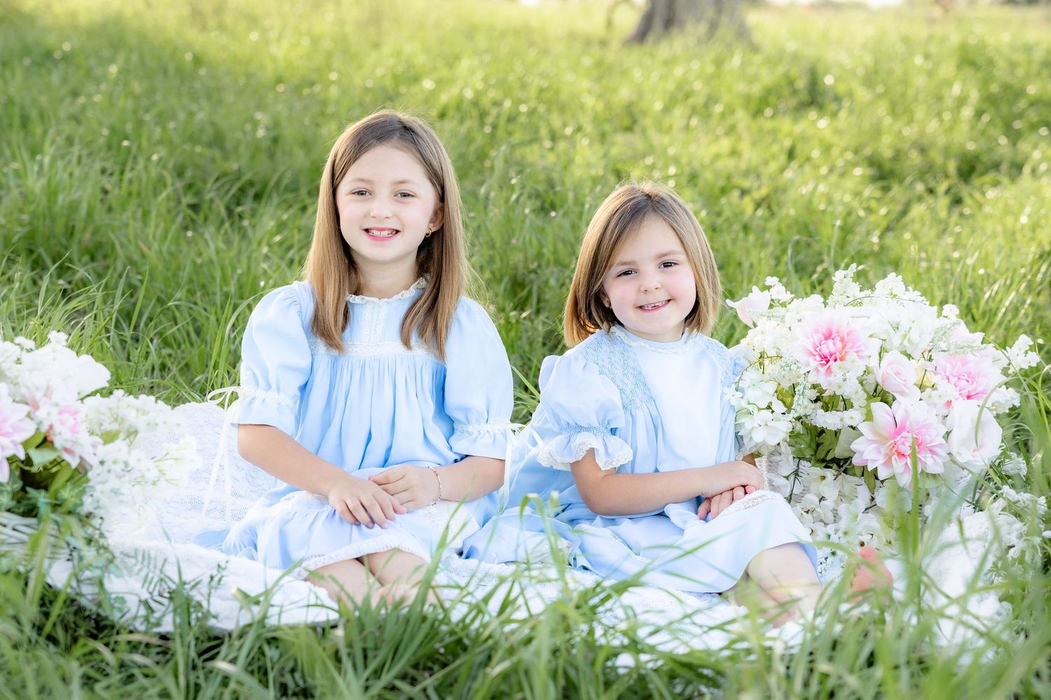 Spring Mini Session with baby chicks in a grass field at sunset near Dothan, Alabama