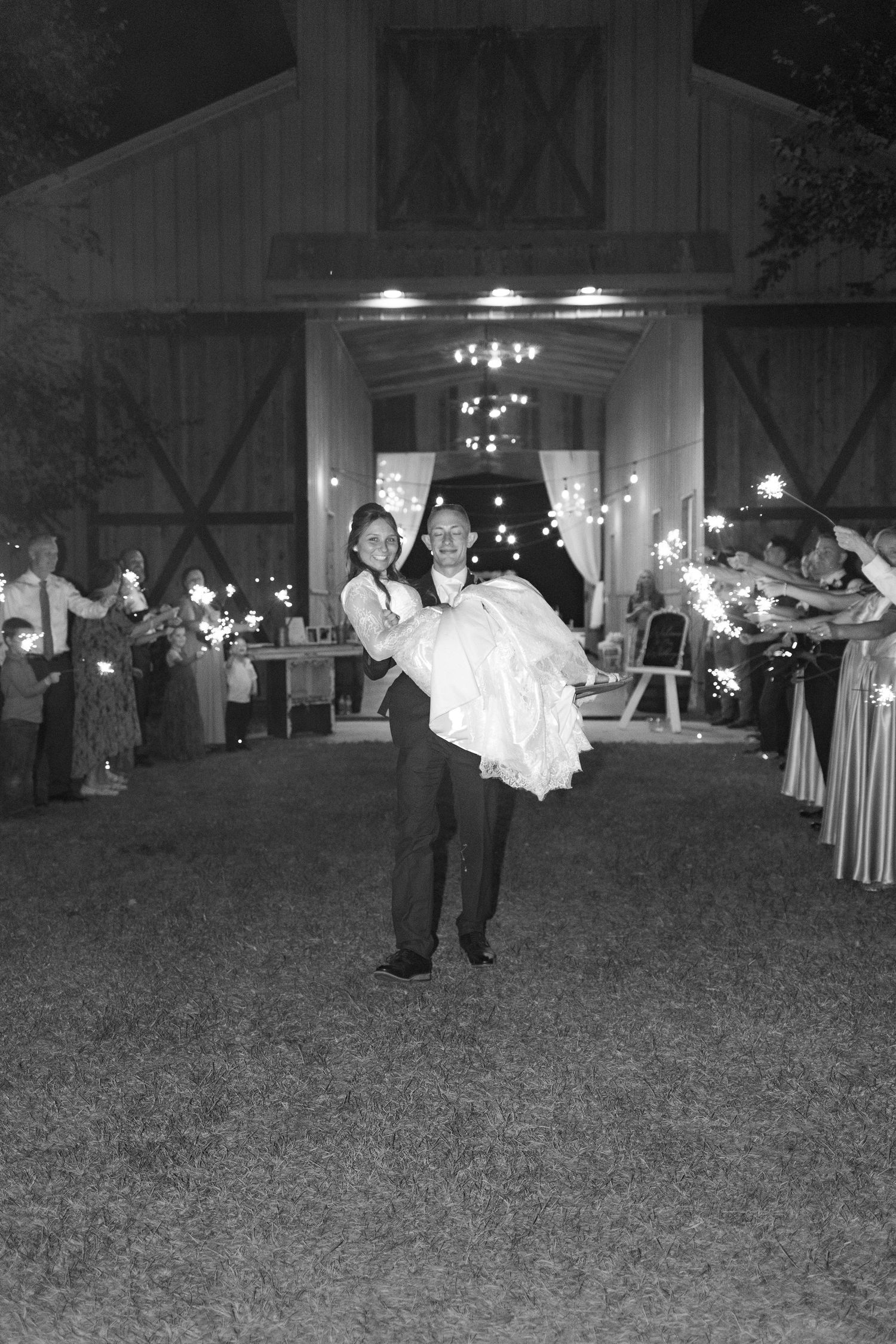 Bride and groom running through a sparkler exit at Dalrymple Farms Enterprise, Alabama