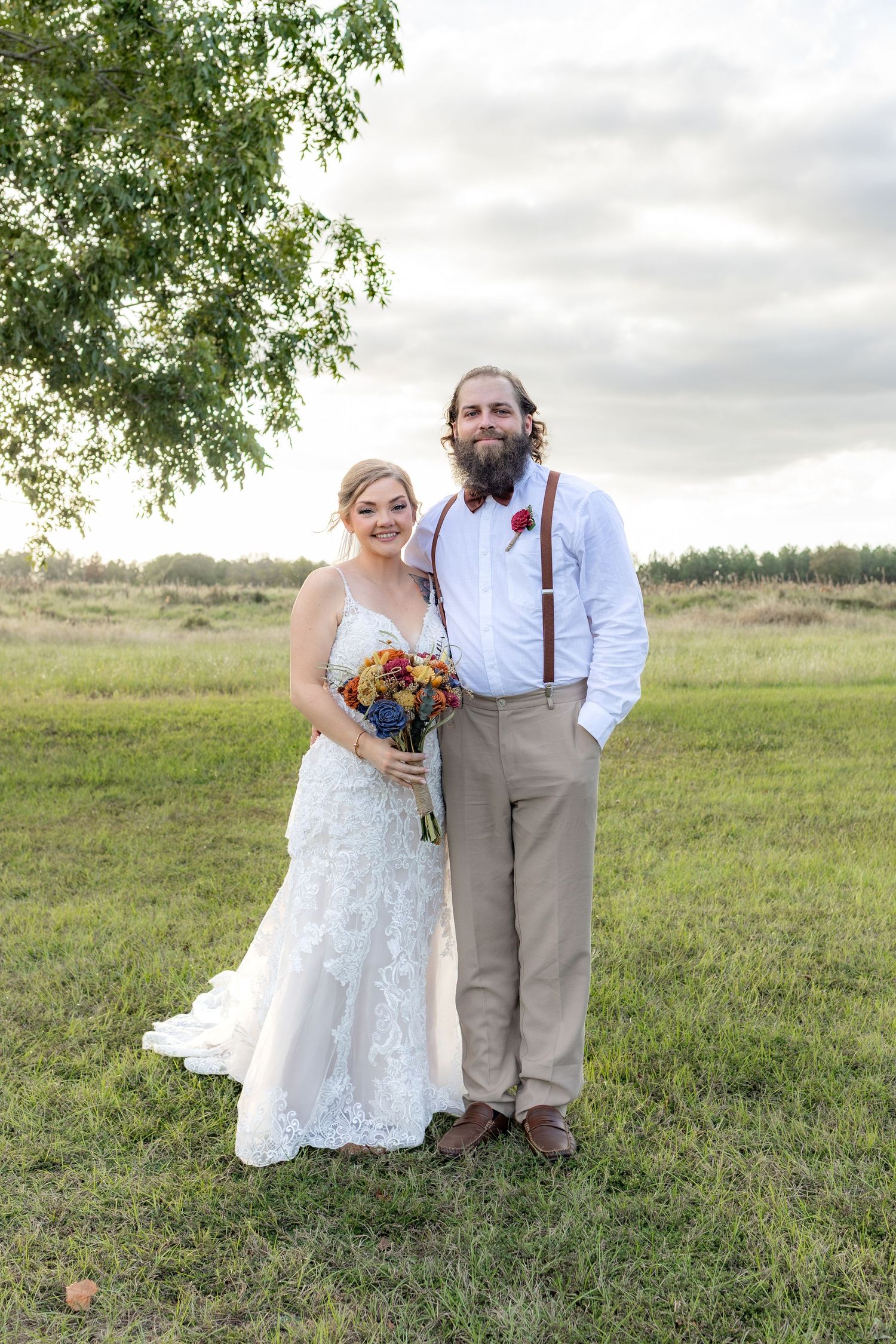 Bride and brother posing for a portrait at Hilltop Acres Wicksburg, Alabama