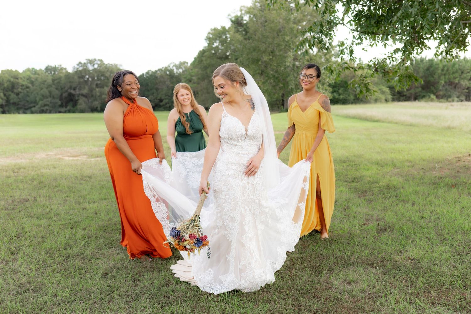 Bridal party posing in a field at sunset at Hilltop Acres Wicksburg, Alabama