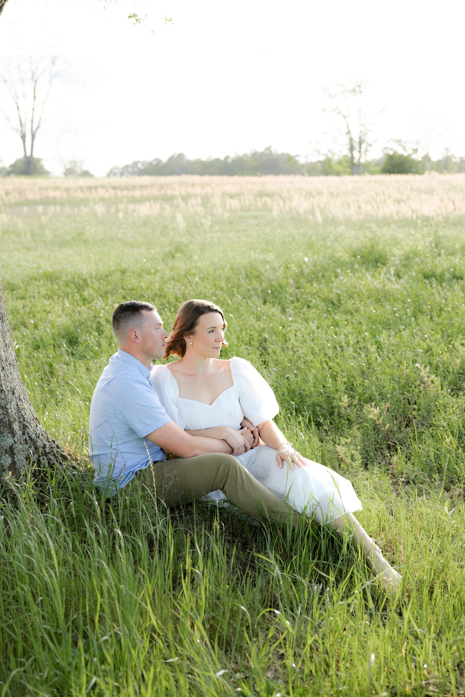 Storytelling romantic couple photos in a tall grass field at sunset in Dothan, Alabama