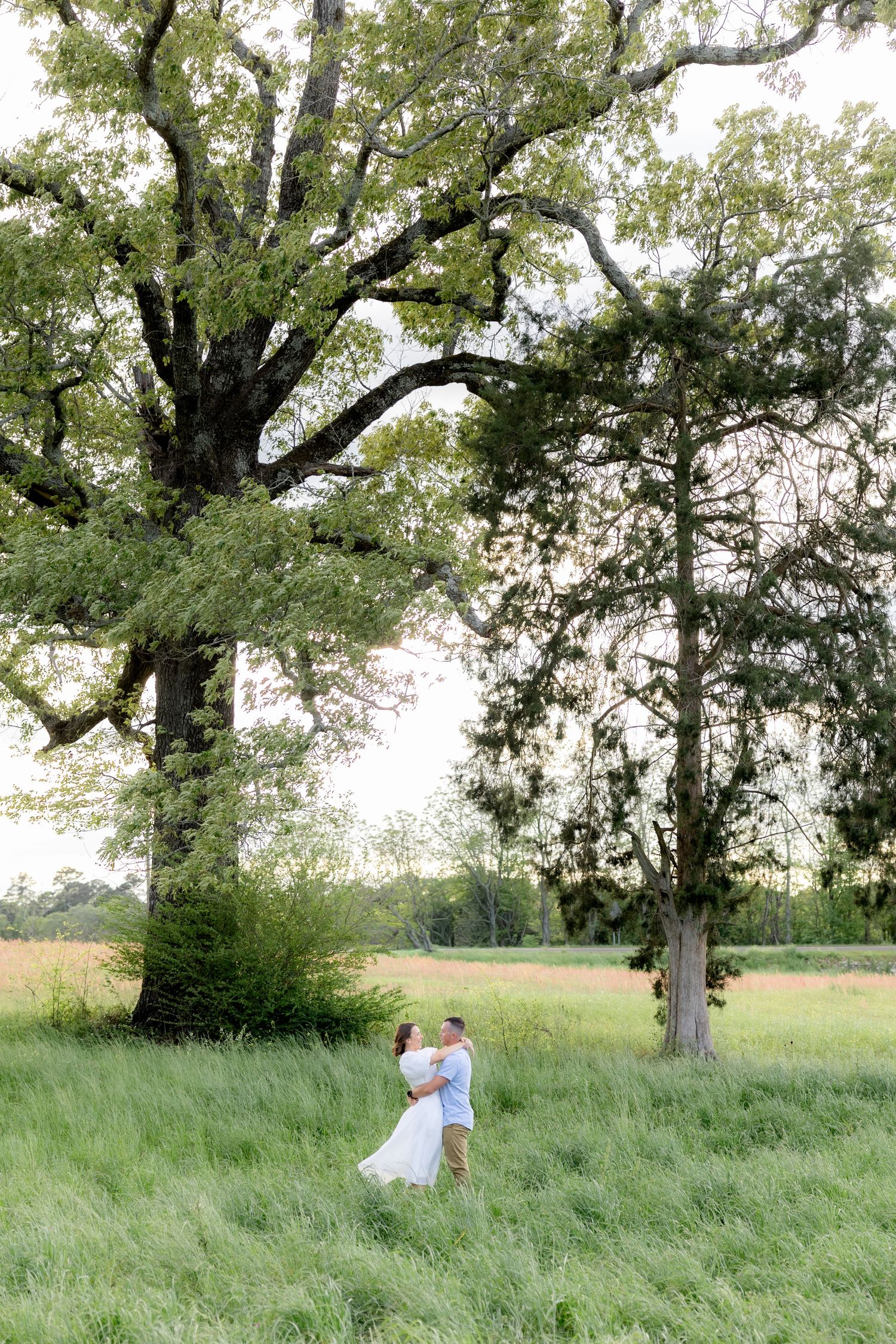 Storytelling romantic couple photos in a tall grass field at sunset in Dothan, Alabama