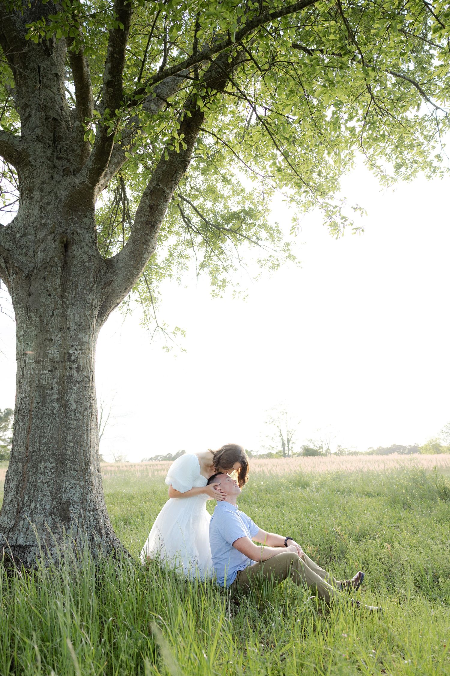 Storytelling romantic couple photos in a tall grass field at sunset in Dothan, Alabama
