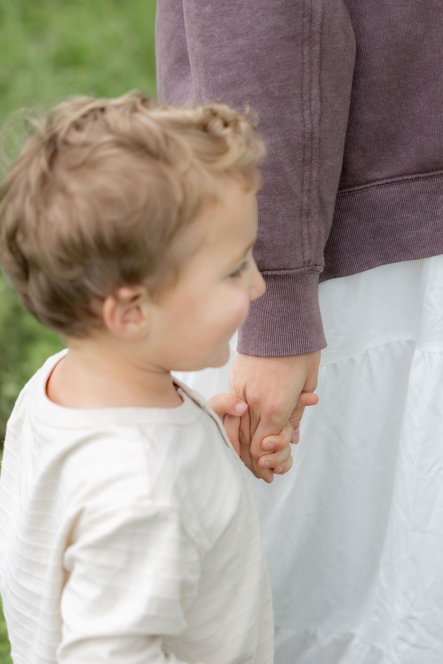 Candid family photos in a grass field | Dothan, Alabama Lifestyle Portrait Photographer