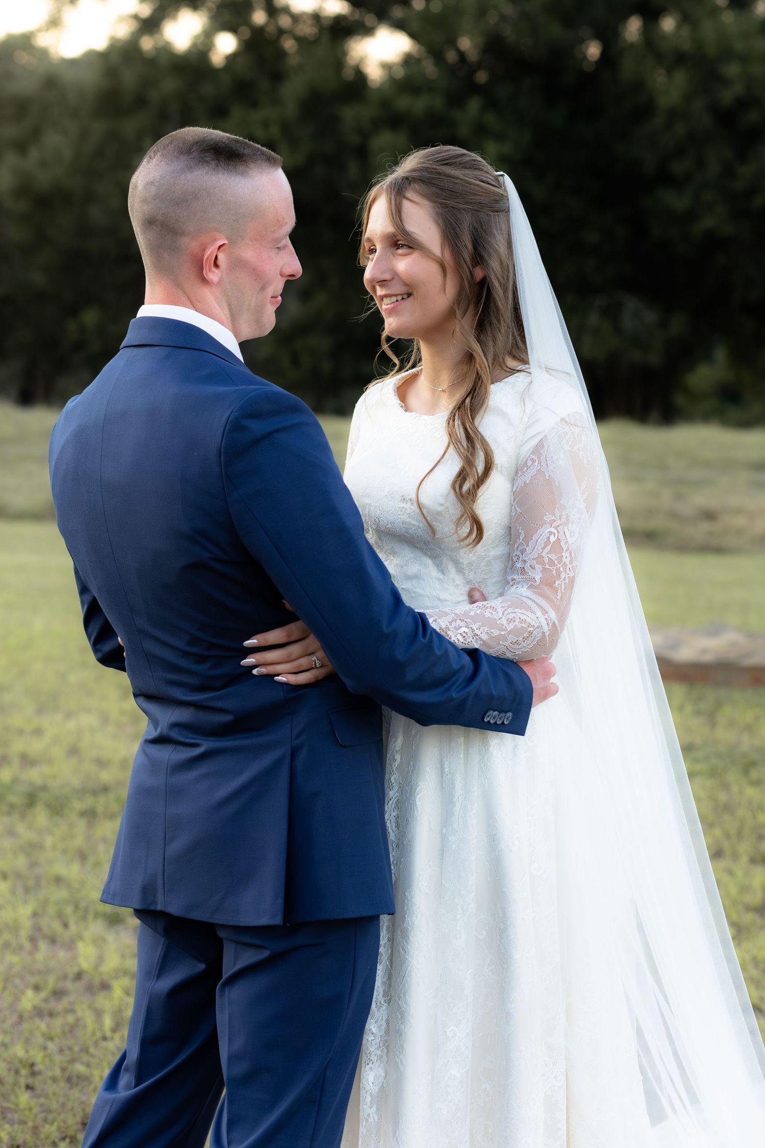 Bride and groom holding each other for portraits at Dalrymple Farms Enterprise, Alabama