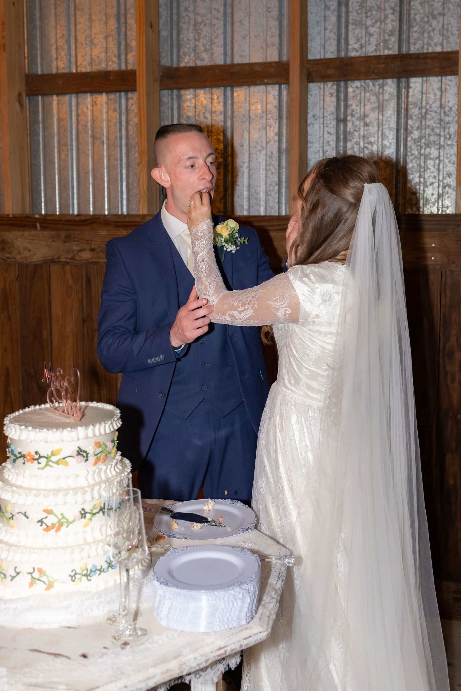 Bride and groom cut cake at their reception at Dalrymple Farms Enterprise, Alabama