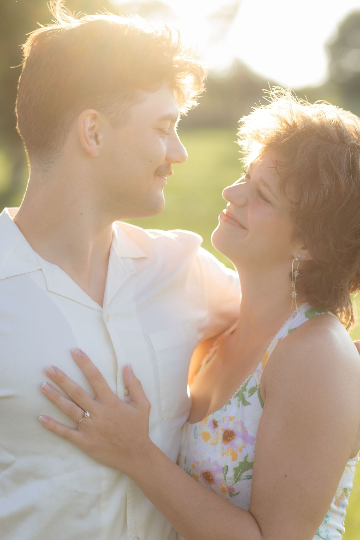 Romantic Couples photos in a tall grass field at sunset near Dothan, Alabama