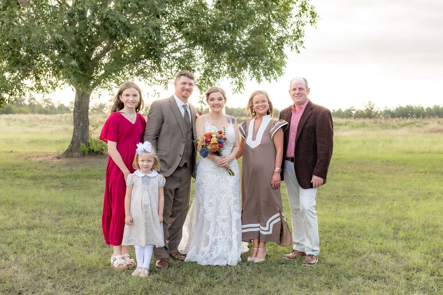 Bride and groom family portraits in a field at Hilltop Acres Wicksburg, Alabama