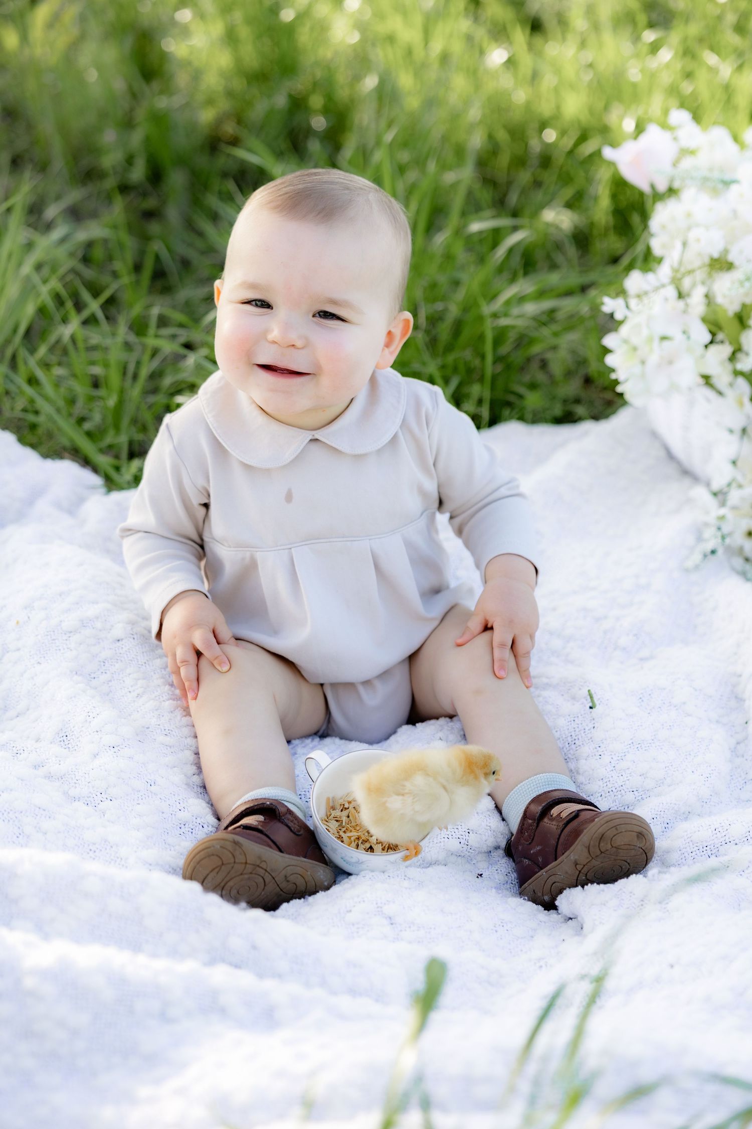 Spring Mini Session with baby chicks in a grass field at sunset near Dothan, Alabama