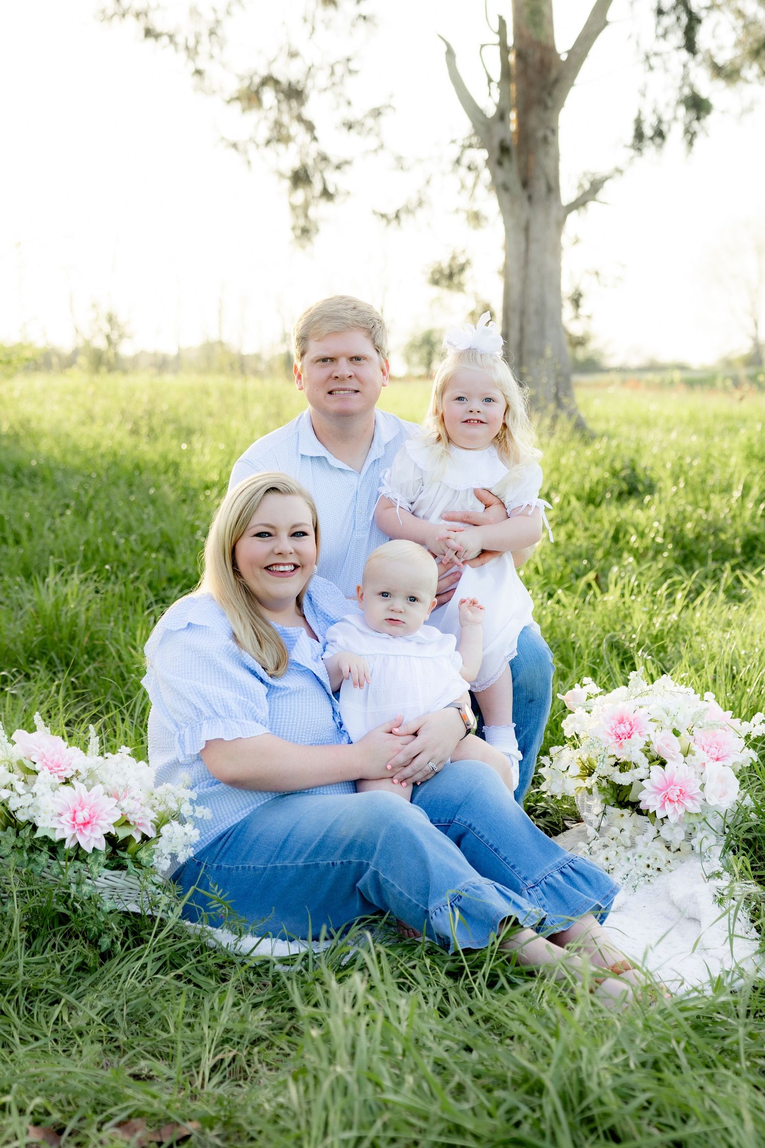 Spring Mini Session with baby chicks in a grass field at sunset near Dothan, Alabama