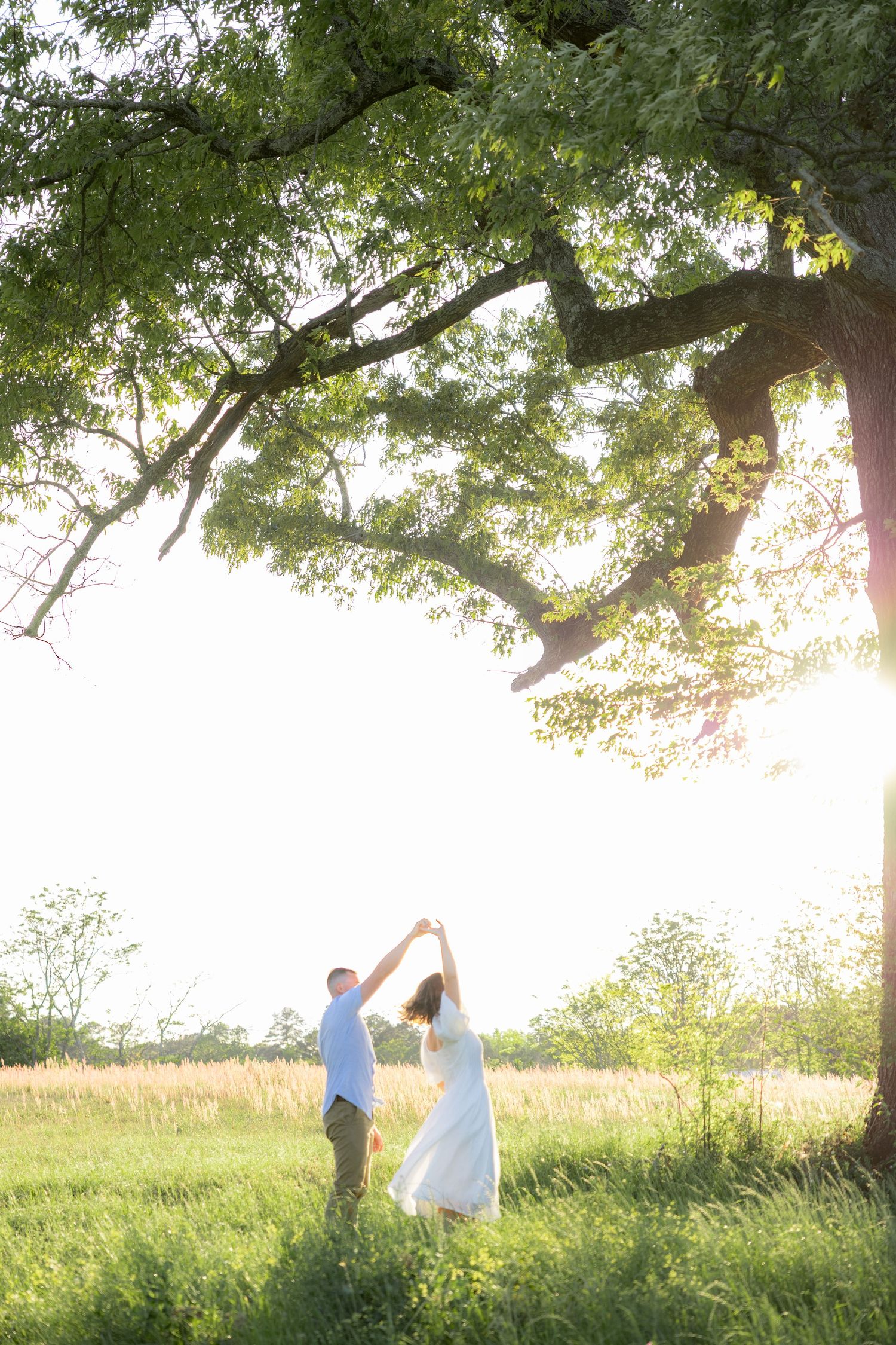 Storytelling couple photos in a tall grass field at sunset in Dothan, Alabama
