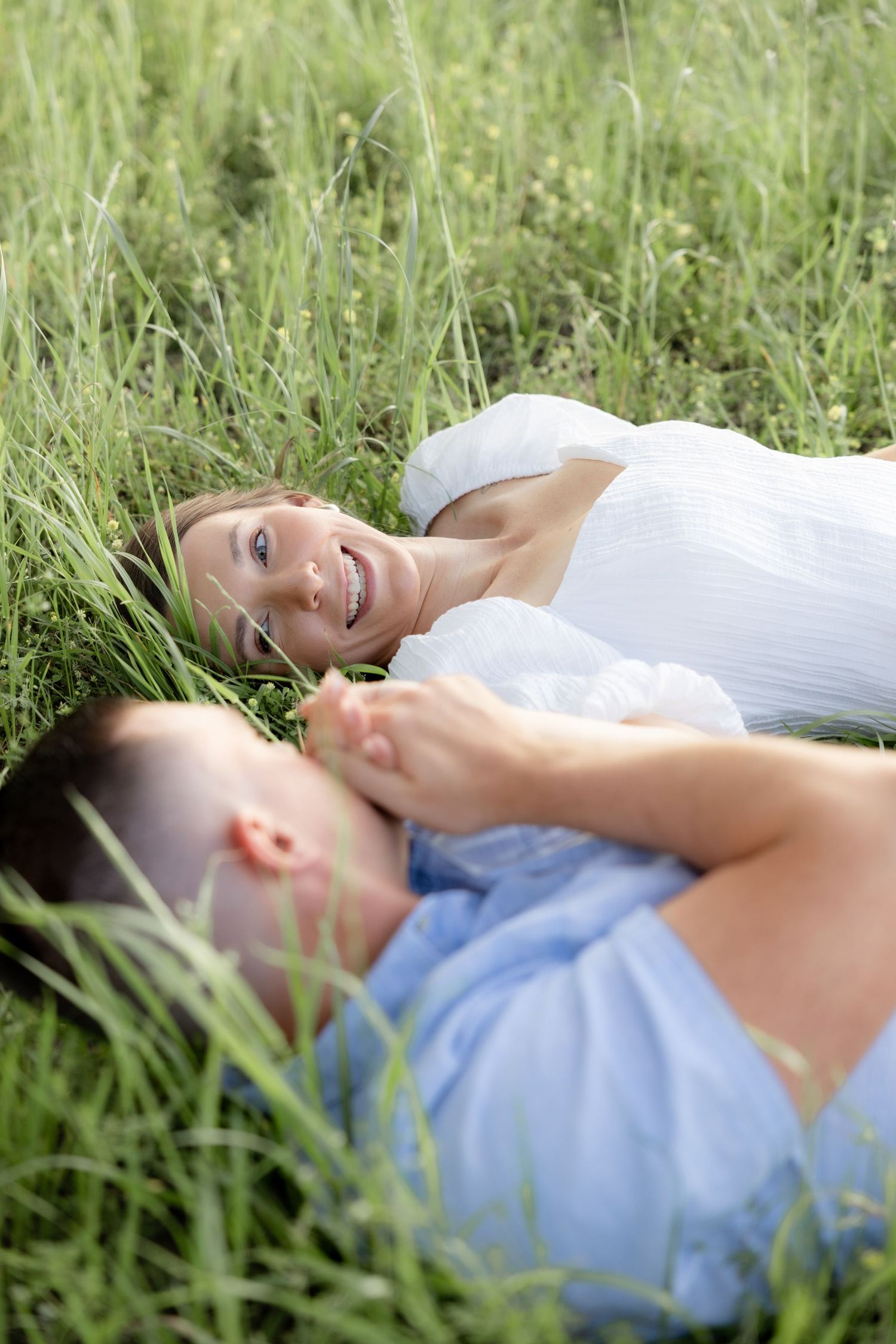 Storytelling couple photos in a tall grass field at sunset in Dothan, Alabama