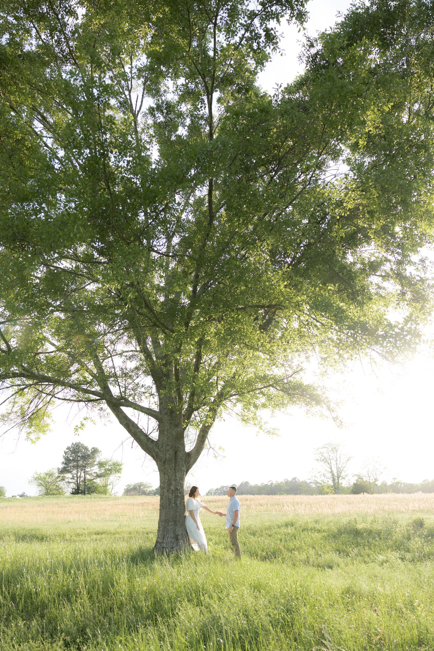 Storytelling romantic couple photos in a tall grass field at sunset in Dothan, Alabama