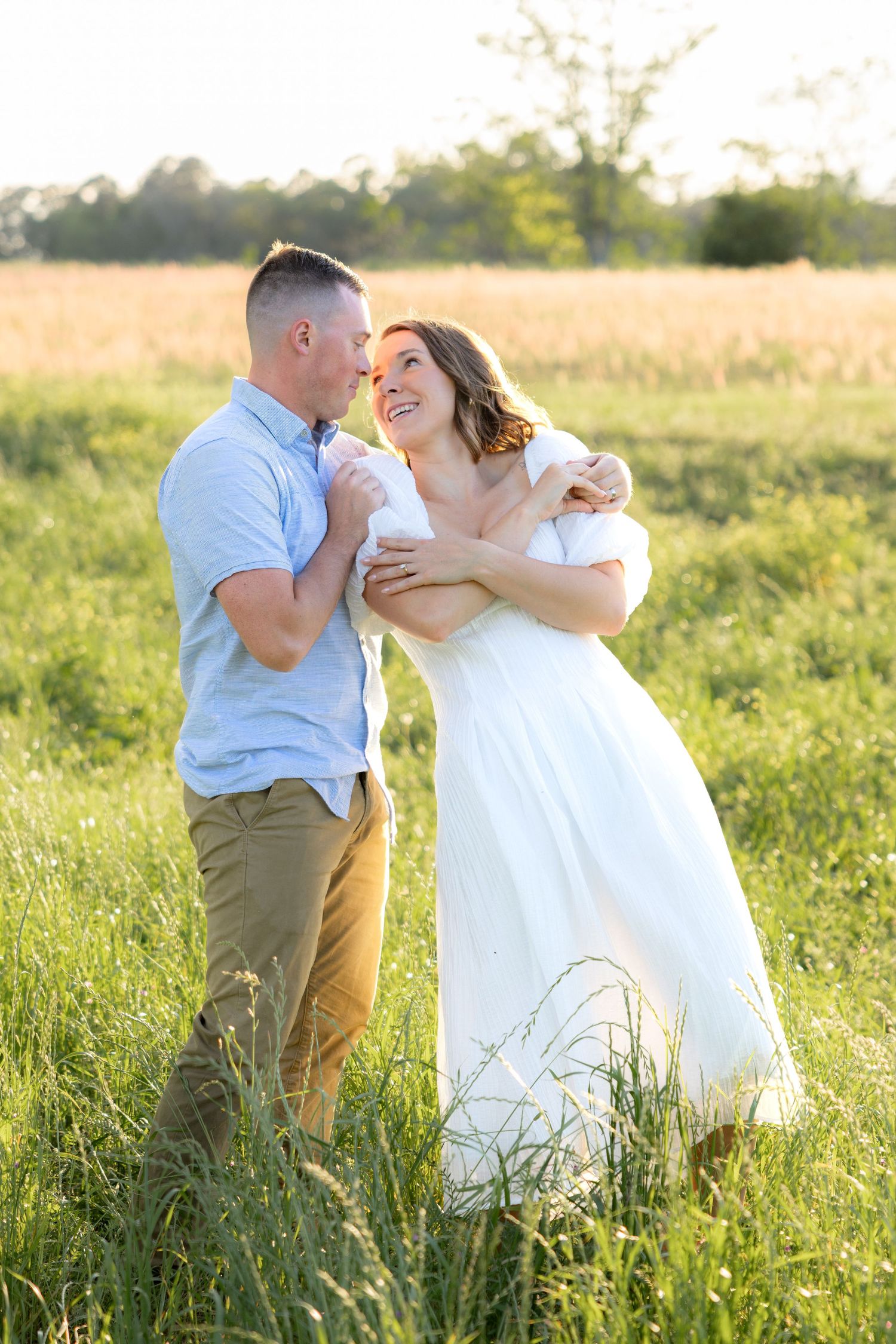 Storytelling couple photos in a tall grass field at sunset in Dothan, Alabama