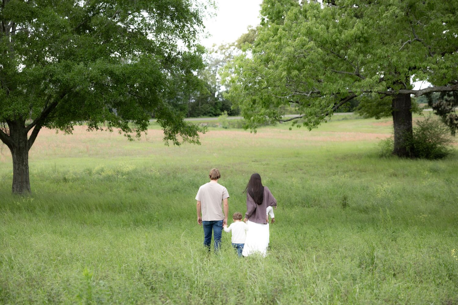 Candid family photos in a grass field | Dothan, Alabama Lifestyle Portrait Photographer
