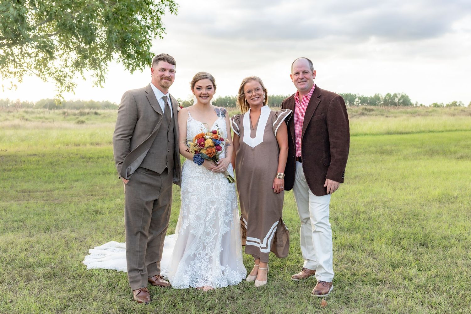 Bride and groom family portraits in a field at Hilltop Acres Wicksburg, Alabama